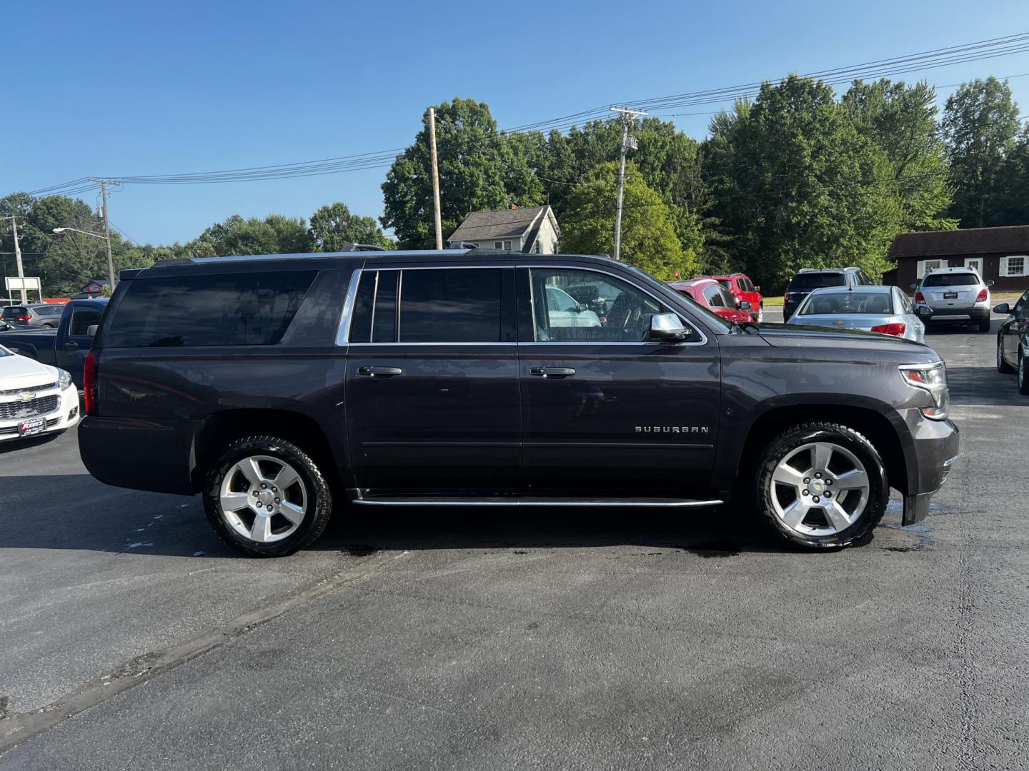 2017 Gray /Black Chevrolet Suburban Premier 4WD (1GNSKJKCXHR) with an 5.3L V8 OHV 16V engine, 6-Speed Automatic transmission, located at 547 E. Main St., Orwell, OH, 44076, (440) 437-5893, 41.535435, -80.847855 - Photo#6