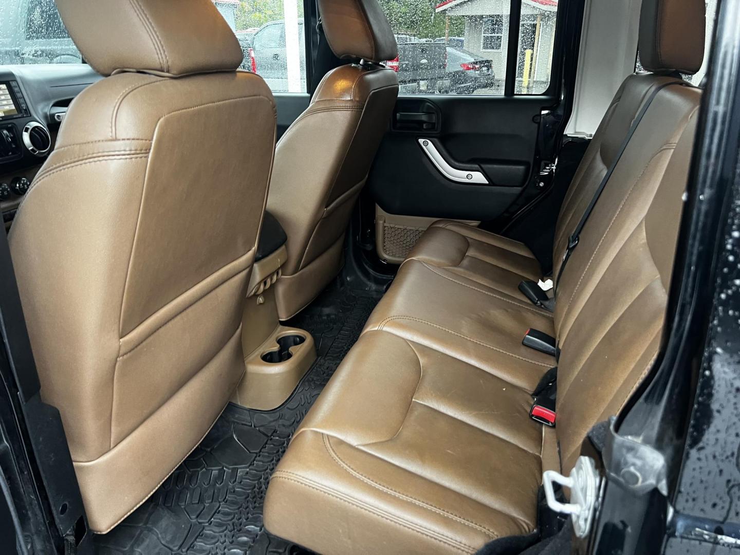 2014 Black /Brown Jeep Wrangler Unlimited Sahara 4WD (1C4BJWEG2EL) with an 3.6L V6 DOHC 24V engine, 5 Speed Auto transmission, located at 547 E. Main St., Orwell, OH, 44076, (440) 437-5893, 41.535435, -80.847855 - This 2014 Jeep Wrangler Unlimited Sahara combines rugged capability with a touch of luxury, catering to adventure enthusiasts who also enjoy comfort. Powered by a 3.6-liter Pentastar V6 engine paired with a 5-speed automatic transmission, it offers robust performance perfect for off-road escapades a - Photo#27