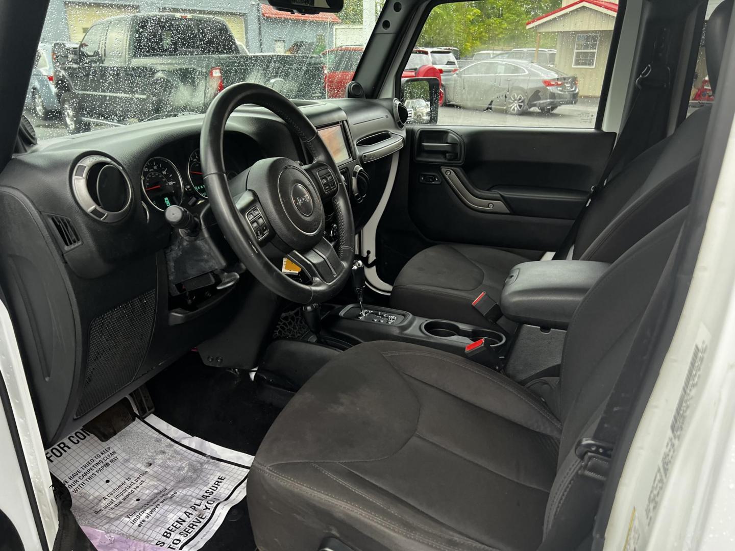 2014 White /Black Jeep Wrangler Unlimited Sport 4WD (1C4BJWDG3EL) with an 3.6L V6 DOHC 24V engine, 5 Speed Auto transmission, located at 547 E. Main St., Orwell, OH, 44076, (440) 437-5893, 41.535435, -80.847855 - Photo#14