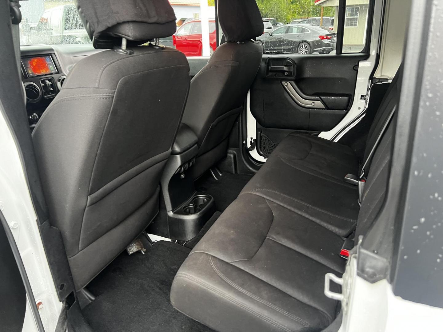 2014 White /Black Jeep Wrangler Unlimited Sport 4WD (1C4BJWDG3EL) with an 3.6L V6 DOHC 24V engine, 5 Speed Auto transmission, located at 547 E. Main St., Orwell, OH, 44076, (440) 437-5893, 41.535435, -80.847855 - Photo#27
