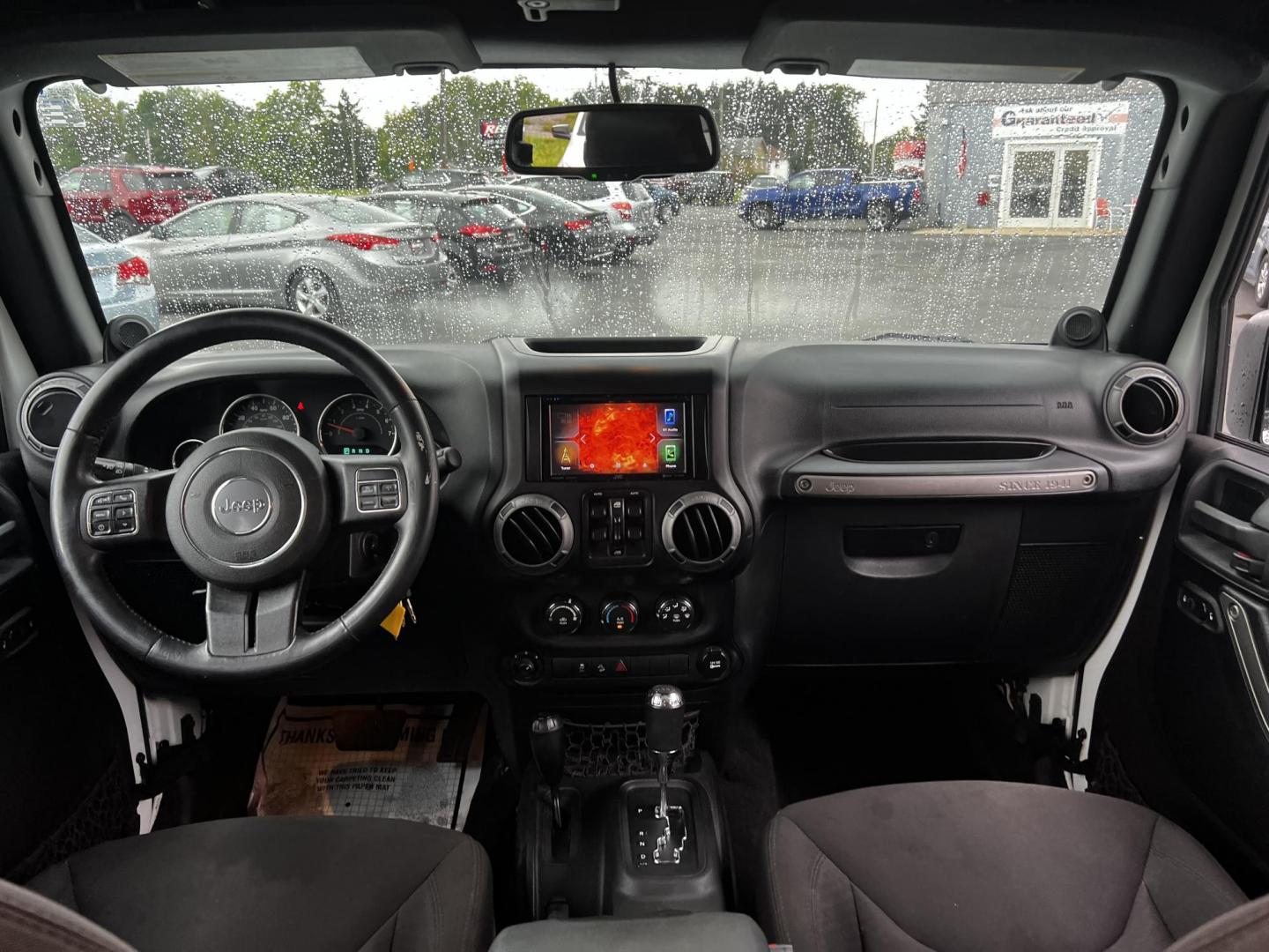 2014 White /Black Jeep Wrangler Unlimited Sport 4WD (1C4BJWDG3EL) with an 3.6L V6 DOHC 24V engine, 5 Speed Auto transmission, located at 547 E. Main St., Orwell, OH, 44076, (440) 437-5893, 41.535435, -80.847855 - Photo#31
