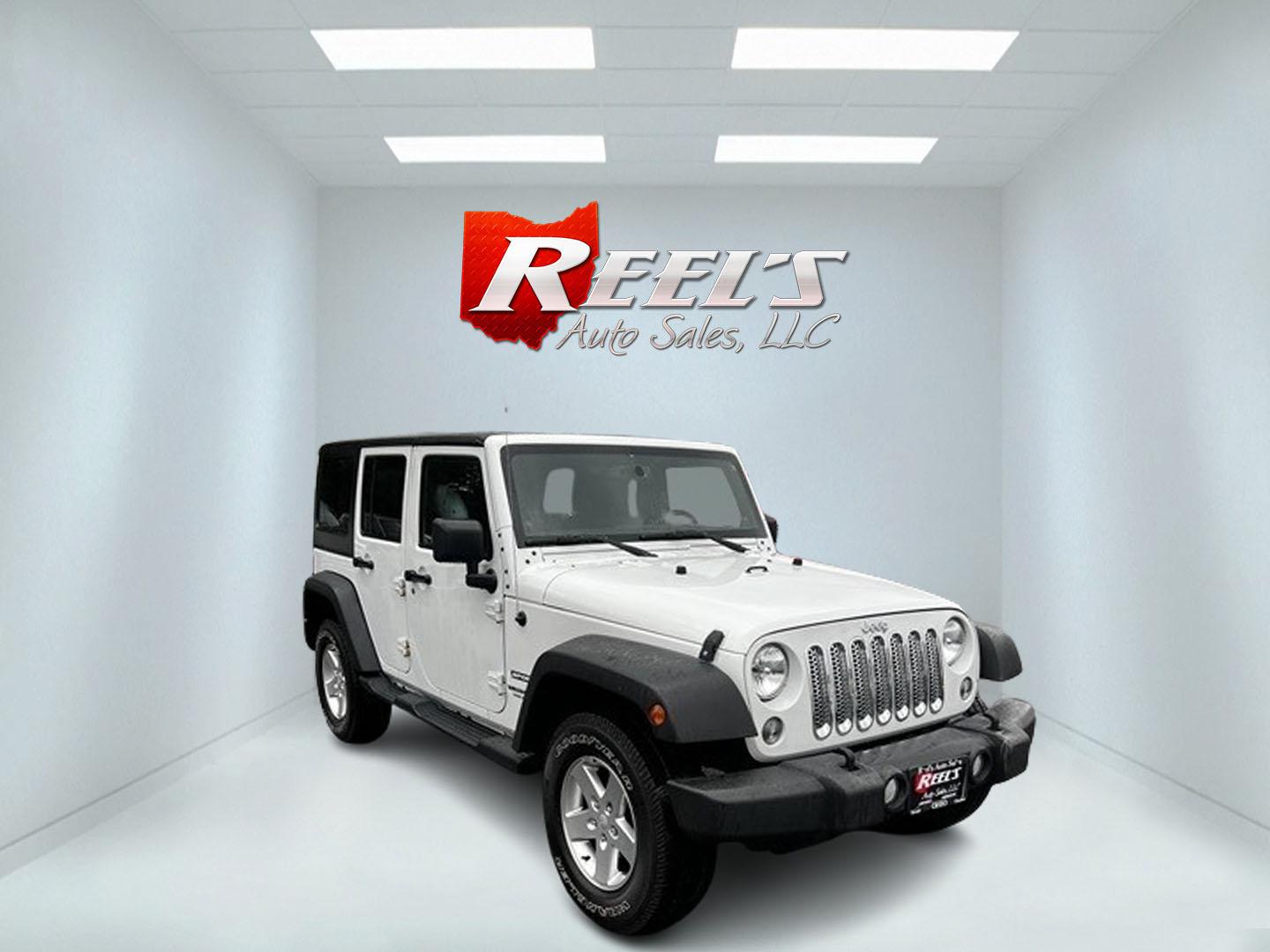 2014 White /Black Jeep Wrangler Unlimited Sport 4WD (1C4BJWDG3EL) with an 3.6L V6 DOHC 24V engine, 5 Speed Auto transmission, located at 547 E. Main St., Orwell, OH, 44076, (440) 437-5893, 41.535435, -80.847855 - Photo#2