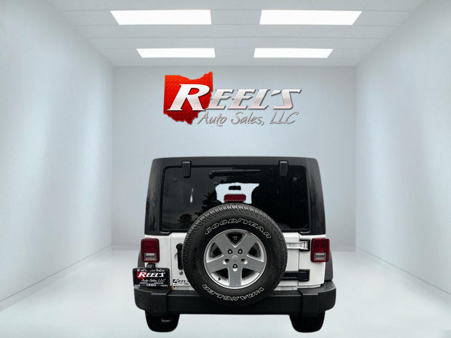 2014 White /Black Jeep Wrangler Unlimited Sport 4WD (1C4BJWDG3EL) with an 3.6L V6 DOHC 24V engine, 5 Speed Auto transmission, located at 547 E. Main St., Orwell, OH, 44076, (440) 437-5893, 41.535435, -80.847855 - Photo#6