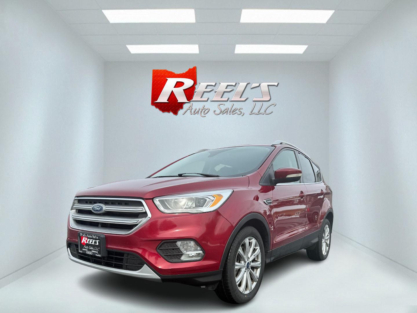 2017 Red /Black Ford Escape Titanium 4WD (1FMCU9JDXHU) with an 1.5L I4 DOHC 16V TURBO engine, 6 Speed Automatic transmission, located at 11115 Chardon Rd. , Chardon, OH, 44024, (440) 214-9705, 41.580246, -81.241943 - Photo#0