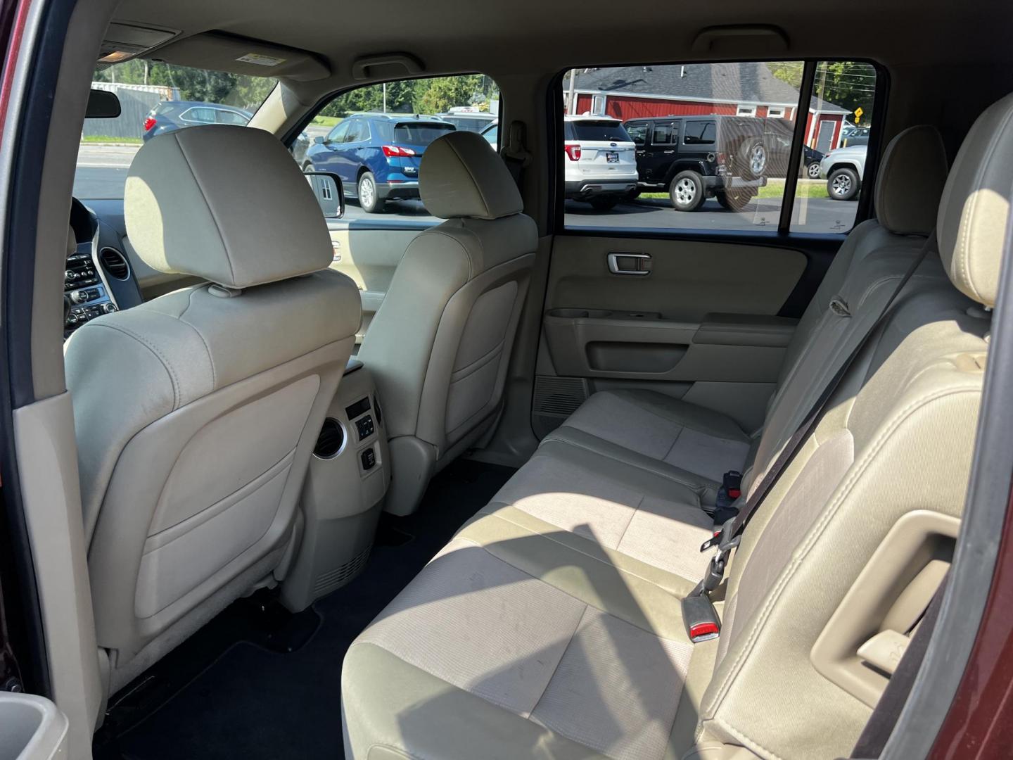 2013 Red /Tan Honda Pilot EX 4WD 5-Spd AT (5FNYF4H45DB) with an 3.5L V6 SOHC 24V engine, 5-Speed Automatic transmission, located at 11115 Chardon Rd. , Chardon, OH, 44024, (440) 214-9705, 41.580246, -81.241943 - Photo#34