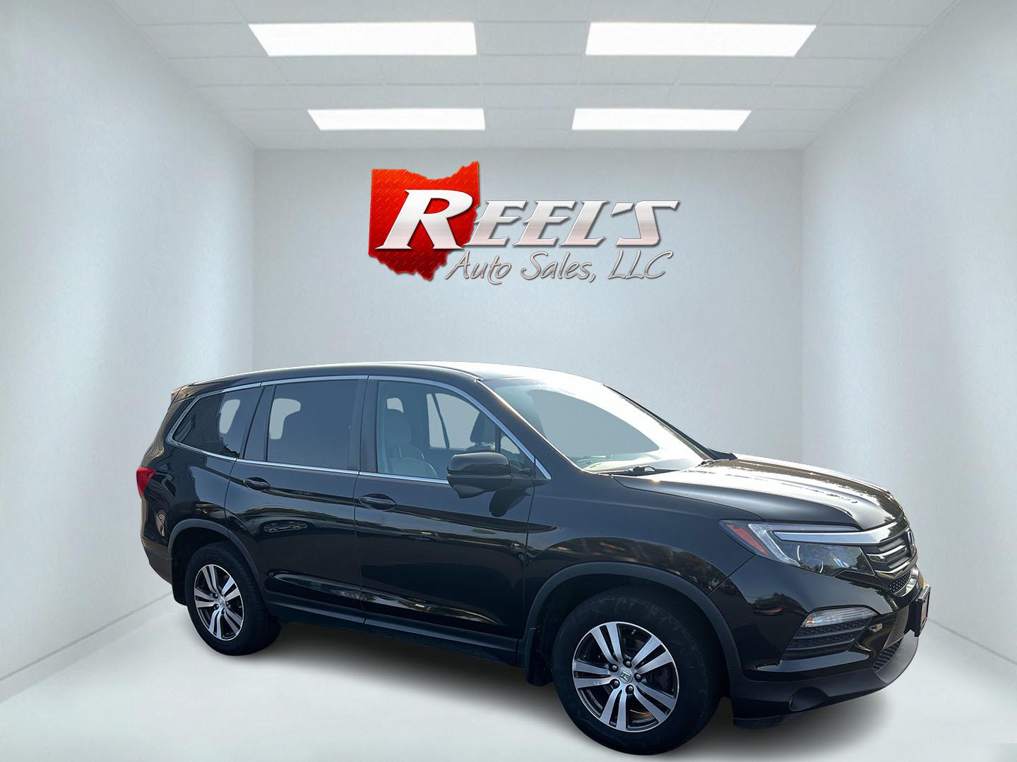 2017 Black /Gray Honda Pilot EX 4WD (5FNYF6H39HB) with an 3.5L V6 SOHC 24V engine, 6 Speed Auto transmission, located at 547 E. Main St., Orwell, OH, 44076, (440) 437-5893, 41.535435, -80.847855 - This 2017 Honda Pilot EX 4WD is a versatile and family-friendly SUV equipped with a 3.5L EarthDreams V6 engine and a 6-speed automatic transmission, offering a smooth driving experience and an efficient highway fuel economy of 26 MPG. It features LED daytime running lights and dusk-sensing headlight - Photo#14