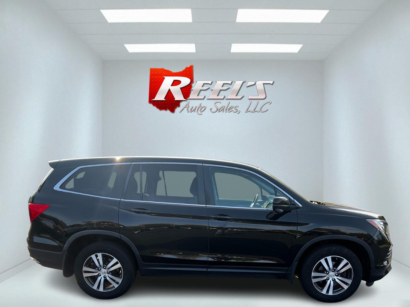 2017 Black /Gray Honda Pilot EX 4WD (5FNYF6H39HB) with an 3.5L V6 SOHC 24V engine, 6 Speed Auto transmission, located at 547 E. Main St., Orwell, OH, 44076, (440) 437-5893, 41.535435, -80.847855 - This 2017 Honda Pilot EX 4WD is a versatile and family-friendly SUV equipped with a 3.5L EarthDreams V6 engine and a 6-speed automatic transmission, offering a smooth driving experience and an efficient highway fuel economy of 26 MPG. It features LED daytime running lights and dusk-sensing headlight - Photo#15
