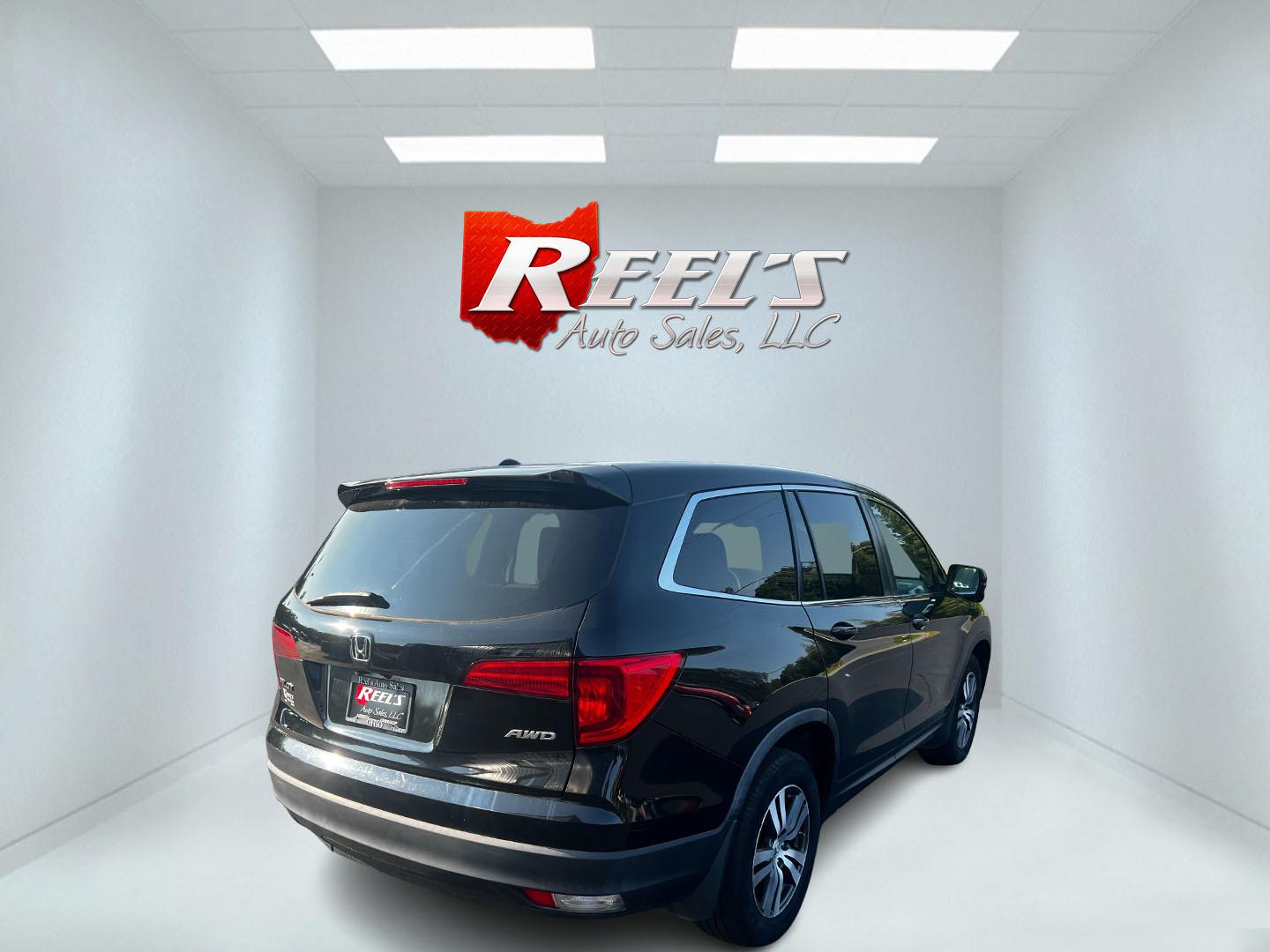 2017 Black /Gray Honda Pilot EX 4WD (5FNYF6H39HB) with an 3.5L V6 SOHC 24V engine, 6 Speed Auto transmission, located at 547 E. Main St., Orwell, OH, 44076, (440) 437-5893, 41.535435, -80.847855 - This 2017 Honda Pilot EX 4WD is a versatile and family-friendly SUV equipped with a 3.5L EarthDreams V6 engine and a 6-speed automatic transmission, offering a smooth driving experience and an efficient highway fuel economy of 26 MPG. It features LED daytime running lights and dusk-sensing headlight - Photo#16