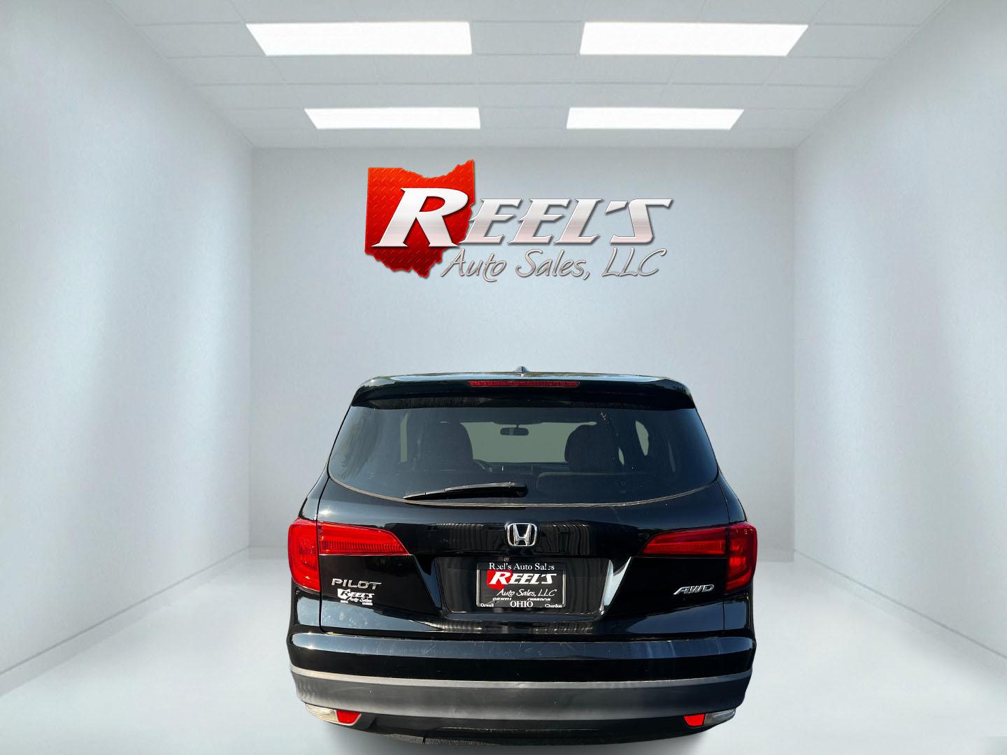 2017 Black /Gray Honda Pilot EX 4WD (5FNYF6H39HB) with an 3.5L V6 SOHC 24V engine, 6 Speed Auto transmission, located at 547 E. Main St., Orwell, OH, 44076, (440) 437-5893, 41.535435, -80.847855 - This 2017 Honda Pilot EX 4WD is a versatile and family-friendly SUV equipped with a 3.5L EarthDreams V6 engine and a 6-speed automatic transmission, offering a smooth driving experience and an efficient highway fuel economy of 26 MPG. It features LED daytime running lights and dusk-sensing headlight - Photo#17