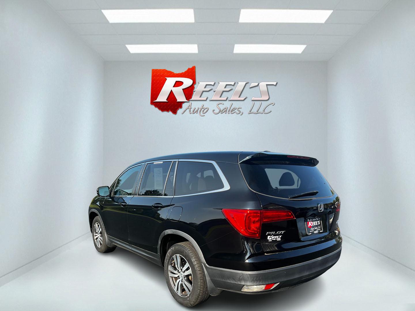 2017 Black /Gray Honda Pilot EX 4WD (5FNYF6H39HB) with an 3.5L V6 SOHC 24V engine, 6 Speed Auto transmission, located at 547 E. Main St., Orwell, OH, 44076, (440) 437-5893, 41.535435, -80.847855 - This 2017 Honda Pilot EX 4WD is a versatile and family-friendly SUV equipped with a 3.5L EarthDreams V6 engine and a 6-speed automatic transmission, offering a smooth driving experience and an efficient highway fuel economy of 26 MPG. It features LED daytime running lights and dusk-sensing headlight - Photo#18