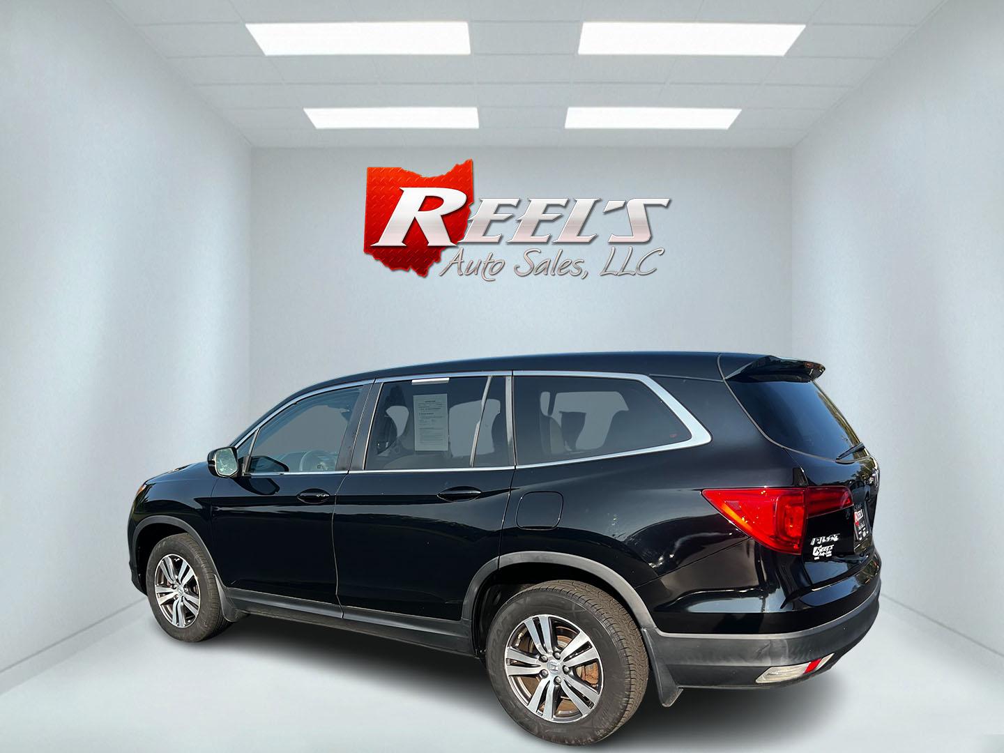 2017 Black /Gray Honda Pilot EX 4WD (5FNYF6H39HB) with an 3.5L V6 SOHC 24V engine, 6 Speed Auto transmission, located at 547 E. Main St., Orwell, OH, 44076, (440) 437-5893, 41.535435, -80.847855 - This 2017 Honda Pilot EX 4WD is a versatile and family-friendly SUV equipped with a 3.5L EarthDreams V6 engine and a 6-speed automatic transmission, offering a smooth driving experience and an efficient highway fuel economy of 26 MPG. It features LED daytime running lights and dusk-sensing headlight - Photo#19