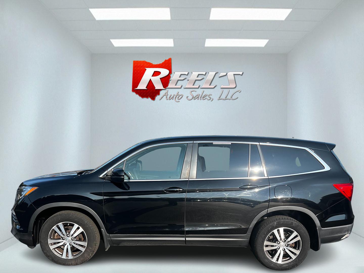 2017 Black /Gray Honda Pilot EX 4WD (5FNYF6H39HB) with an 3.5L V6 SOHC 24V engine, 6 Speed Auto transmission, located at 547 E. Main St., Orwell, OH, 44076, (440) 437-5893, 41.535435, -80.847855 - This 2017 Honda Pilot EX 4WD is a versatile and family-friendly SUV equipped with a 3.5L EarthDreams V6 engine and a 6-speed automatic transmission, offering a smooth driving experience and an efficient highway fuel economy of 26 MPG. It features LED daytime running lights and dusk-sensing headlight - Photo#20