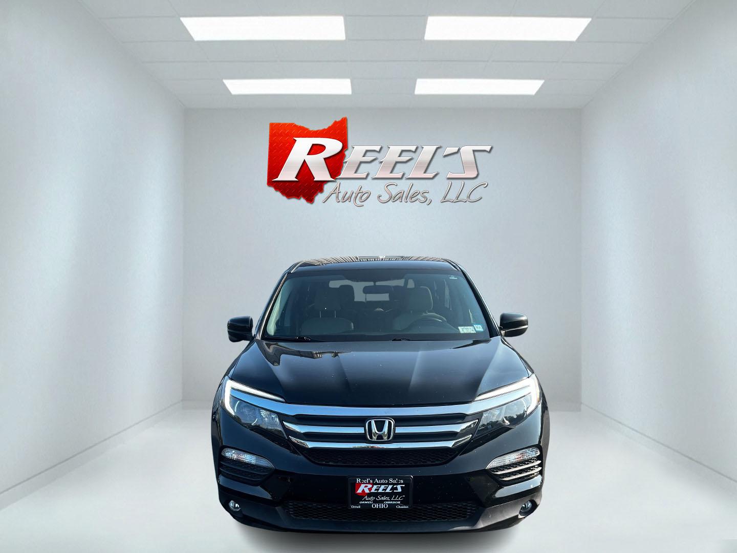 2017 Black /Gray Honda Pilot EX 4WD (5FNYF6H39HB) with an 3.5L V6 SOHC 24V engine, 6 Speed Auto transmission, located at 547 E. Main St., Orwell, OH, 44076, (440) 437-5893, 41.535435, -80.847855 - This 2017 Honda Pilot EX 4WD is a versatile and family-friendly SUV equipped with a 3.5L EarthDreams V6 engine and a 6-speed automatic transmission, offering a smooth driving experience and an efficient highway fuel economy of 26 MPG. It features LED daytime running lights and dusk-sensing headlight - Photo#1