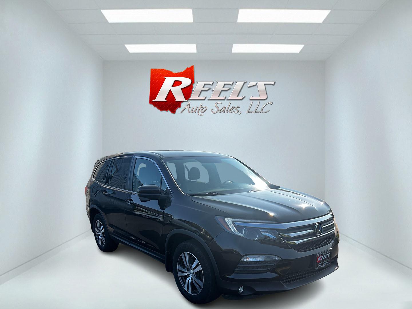 2017 Black /Gray Honda Pilot EX 4WD (5FNYF6H39HB) with an 3.5L V6 SOHC 24V engine, 6 Speed Auto transmission, located at 547 E. Main St., Orwell, OH, 44076, (440) 437-5893, 41.535435, -80.847855 - This 2017 Honda Pilot EX 4WD is a versatile and family-friendly SUV equipped with a 3.5L EarthDreams V6 engine and a 6-speed automatic transmission, offering a smooth driving experience and an efficient highway fuel economy of 26 MPG. It features LED daytime running lights and dusk-sensing headlight - Photo#2