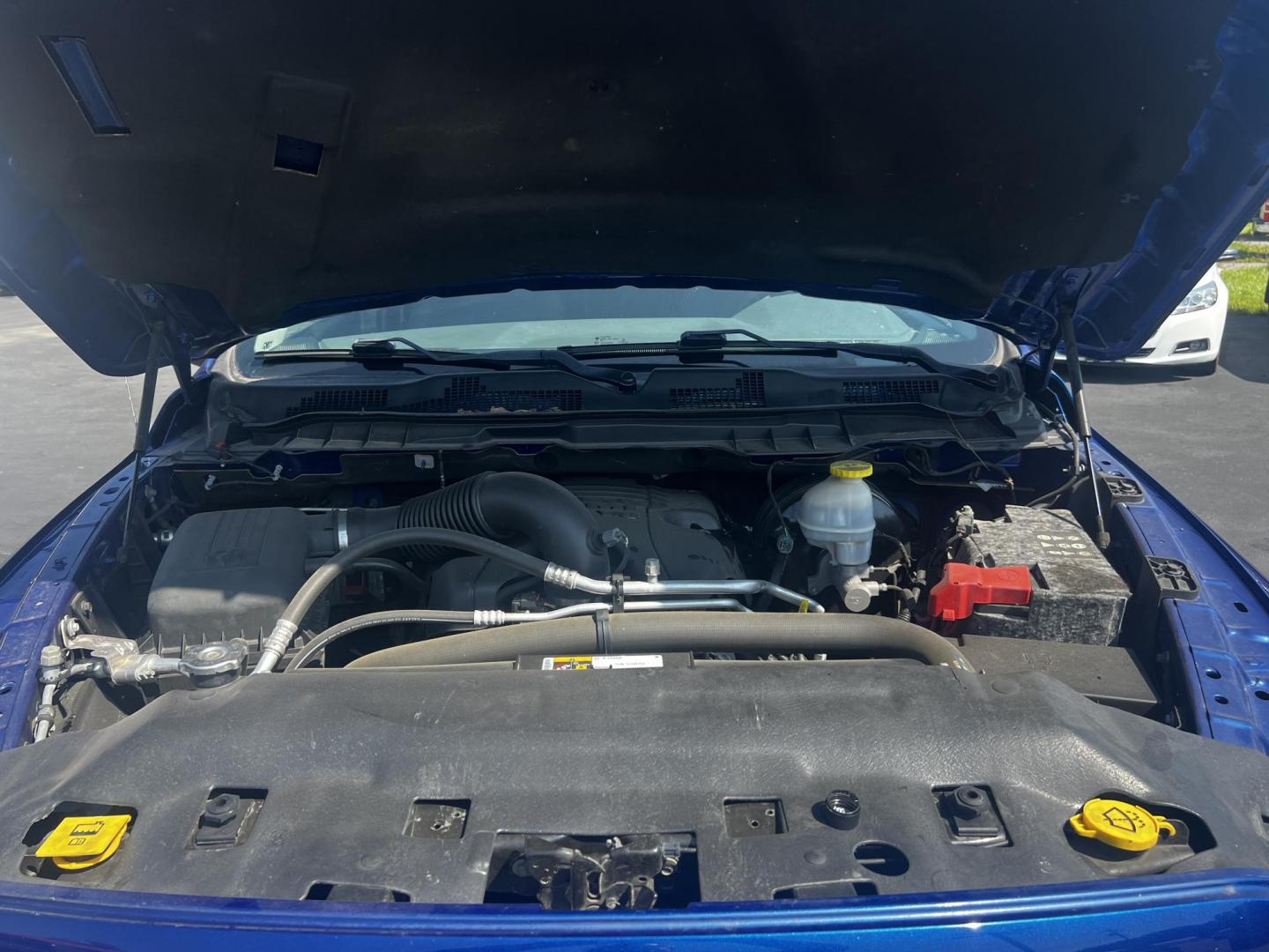 2018 Blue /Black RAM 1500 Express Quad Cab 4WD (1C6RR7FT4JS) with an 5.7L V8 OHV 16V engine, 8A transmission, located at 547 E. Main St., Orwell, OH, 44076, (440) 437-5893, 41.535435, -80.847855 - This 2018 Ram 1500 Express Quad Cab 4WD is a robust pickup truck powered by a 5.7L HEMI V8 engine, delivering 395 horsepower and paired with an 8-speed automatic transmission. This combination ensures strong performance and an 8,000-pound towing capacity, suitable for both work and recreational need - Photo#14