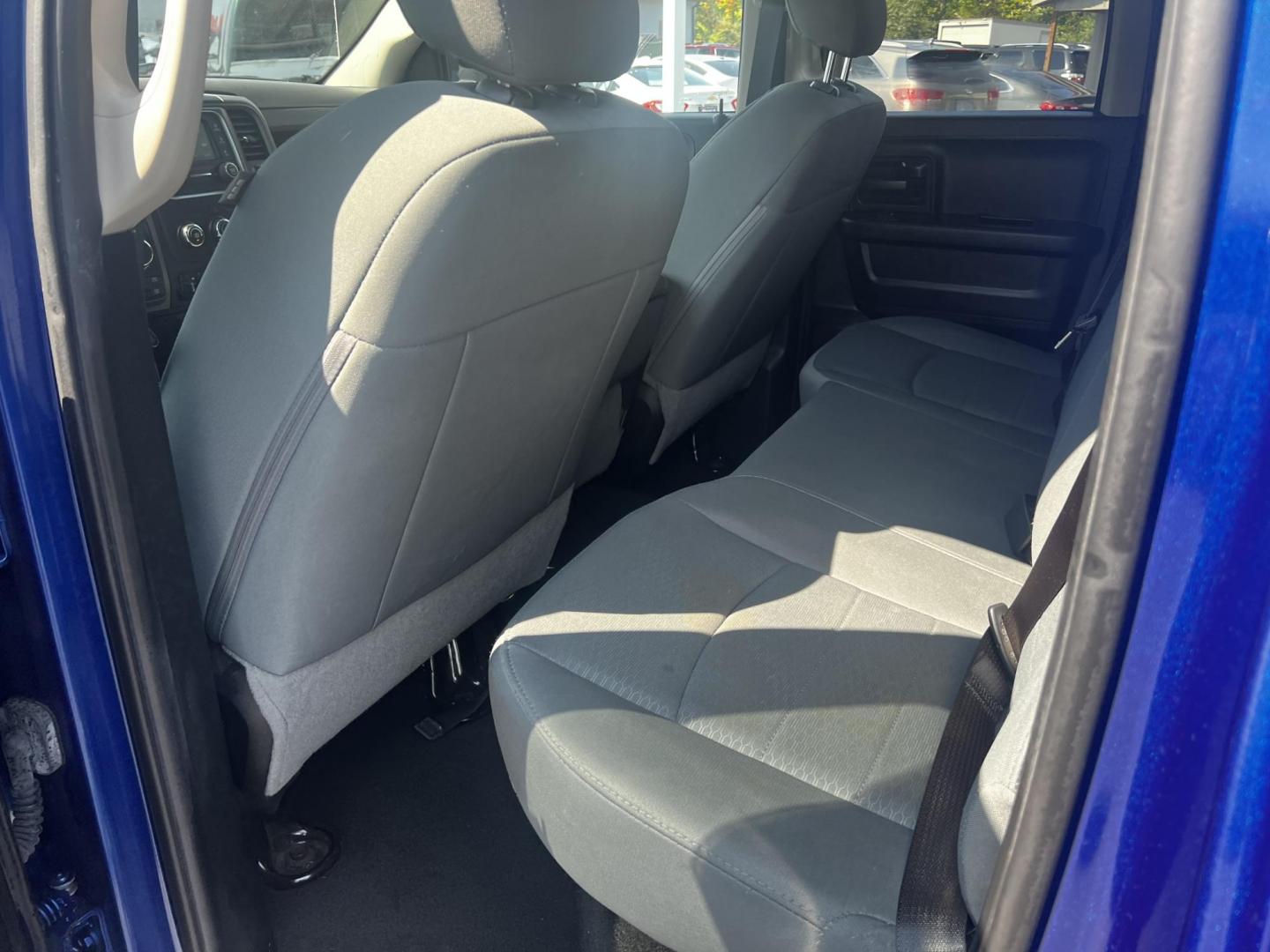 2018 Blue /Black RAM 1500 Express Quad Cab 4WD (1C6RR7FT4JS) with an 5.7L V8 OHV 16V engine, 8A transmission, located at 547 E. Main St., Orwell, OH, 44076, (440) 437-5893, 41.535435, -80.847855 - This 2018 Ram 1500 Express Quad Cab 4WD is a robust pickup truck powered by a 5.7L HEMI V8 engine, delivering 395 horsepower and paired with an 8-speed automatic transmission. This combination ensures strong performance and an 8,000-pound towing capacity, suitable for both work and recreational need - Photo#26