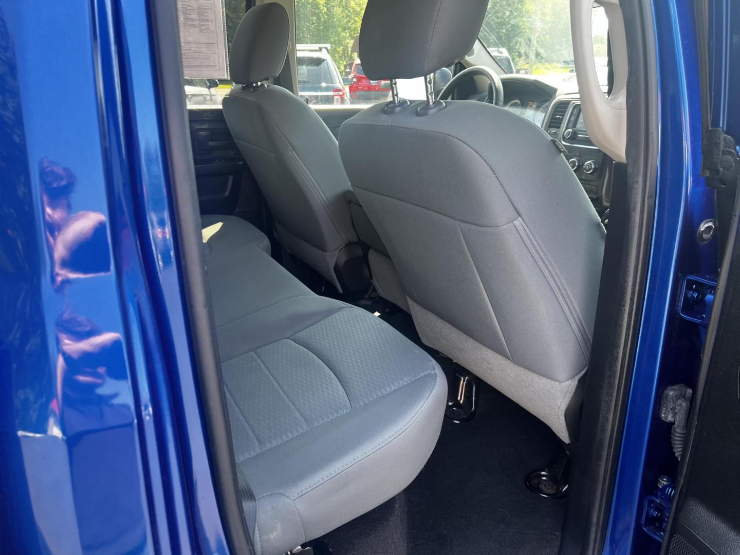 2018 Blue /Black RAM 1500 Express Quad Cab 4WD (1C6RR7FT4JS) with an 5.7L V8 OHV 16V engine, 8A transmission, located at 547 E. Main St., Orwell, OH, 44076, (440) 437-5893, 41.535435, -80.847855 - This 2018 Ram 1500 Express Quad Cab 4WD is a robust pickup truck powered by a 5.7L HEMI V8 engine, delivering 395 horsepower and paired with an 8-speed automatic transmission. This combination ensures strong performance and an 8,000-pound towing capacity, suitable for both work and recreational need - Photo#30