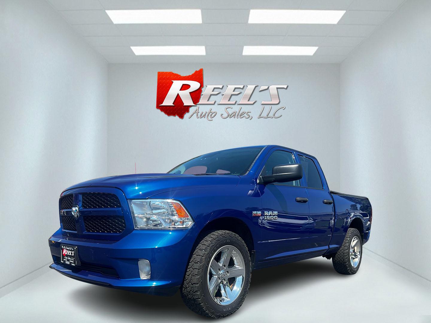 2018 Blue /Black RAM 1500 Express Quad Cab 4WD (1C6RR7FT4JS) with an 5.7L V8 OHV 16V engine, 8A transmission, located at 547 E. Main St., Orwell, OH, 44076, (440) 437-5893, 41.535435, -80.847855 - This 2018 Ram 1500 Express Quad Cab 4WD is a robust pickup truck powered by a 5.7L HEMI V8 engine, delivering 395 horsepower and paired with an 8-speed automatic transmission. This combination ensures strong performance and an 8,000-pound towing capacity, suitable for both work and recreational need - Photo#0