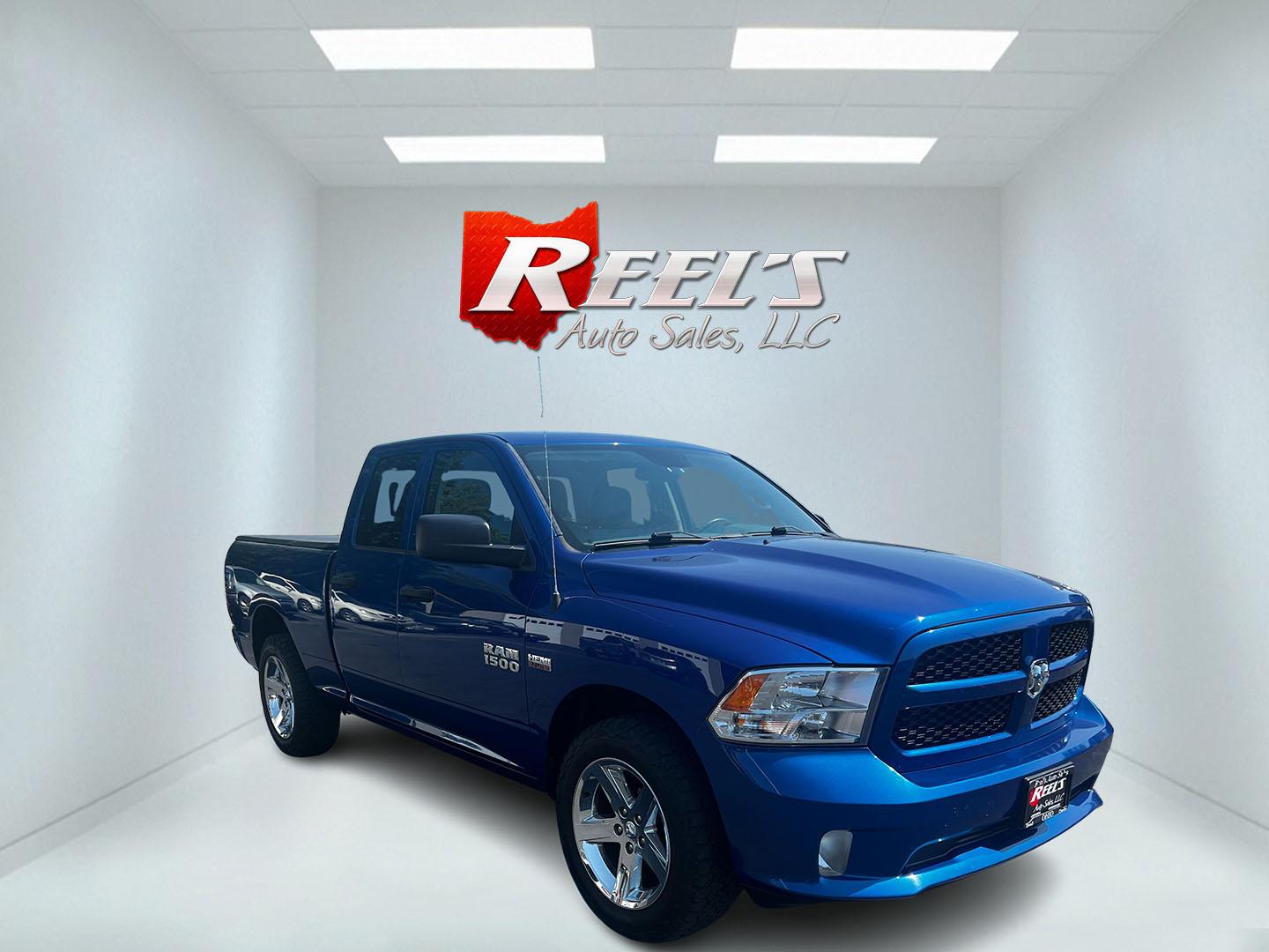 2018 Blue /Black RAM 1500 Express Quad Cab 4WD (1C6RR7FT4JS) with an 5.7L V8 OHV 16V engine, 8A transmission, located at 547 E. Main St., Orwell, OH, 44076, (440) 437-5893, 41.535435, -80.847855 - This 2018 Ram 1500 Express Quad Cab 4WD is a robust pickup truck powered by a 5.7L HEMI V8 engine, delivering 395 horsepower and paired with an 8-speed automatic transmission. This combination ensures strong performance and an 8,000-pound towing capacity, suitable for both work and recreational need - Photo#2