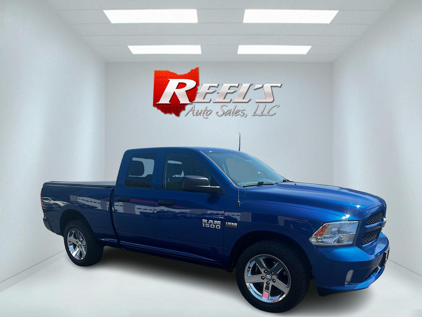 2018 Blue /Black RAM 1500 Express Quad Cab 4WD (1C6RR7FT4JS) with an 5.7L V8 OHV 16V engine, 8A transmission, located at 547 E. Main St., Orwell, OH, 44076, (440) 437-5893, 41.535435, -80.847855 - This 2018 Ram 1500 Express Quad Cab 4WD is a robust pickup truck powered by a 5.7L HEMI V8 engine, delivering 395 horsepower and paired with an 8-speed automatic transmission. This combination ensures strong performance and an 8,000-pound towing capacity, suitable for both work and recreational need - Photo#3