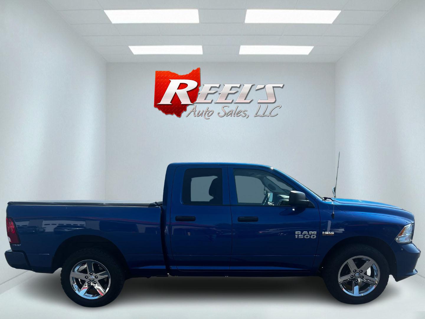 2018 Blue /Black RAM 1500 Express Quad Cab 4WD (1C6RR7FT4JS) with an 5.7L V8 OHV 16V engine, 8A transmission, located at 547 E. Main St., Orwell, OH, 44076, (440) 437-5893, 41.535435, -80.847855 - This 2018 Ram 1500 Express Quad Cab 4WD is a robust pickup truck powered by a 5.7L HEMI V8 engine, delivering 395 horsepower and paired with an 8-speed automatic transmission. This combination ensures strong performance and an 8,000-pound towing capacity, suitable for both work and recreational need - Photo#4