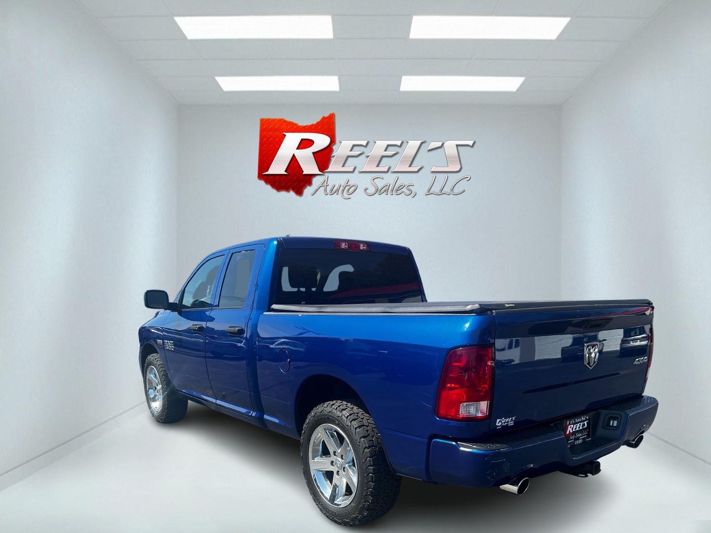 2018 Blue /Black RAM 1500 Express Quad Cab 4WD (1C6RR7FT4JS) with an 5.7L V8 OHV 16V engine, 8A transmission, located at 547 E. Main St., Orwell, OH, 44076, (440) 437-5893, 41.535435, -80.847855 - This 2018 Ram 1500 Express Quad Cab 4WD is a robust pickup truck powered by a 5.7L HEMI V8 engine, delivering 395 horsepower and paired with an 8-speed automatic transmission. This combination ensures strong performance and an 8,000-pound towing capacity, suitable for both work and recreational need - Photo#7