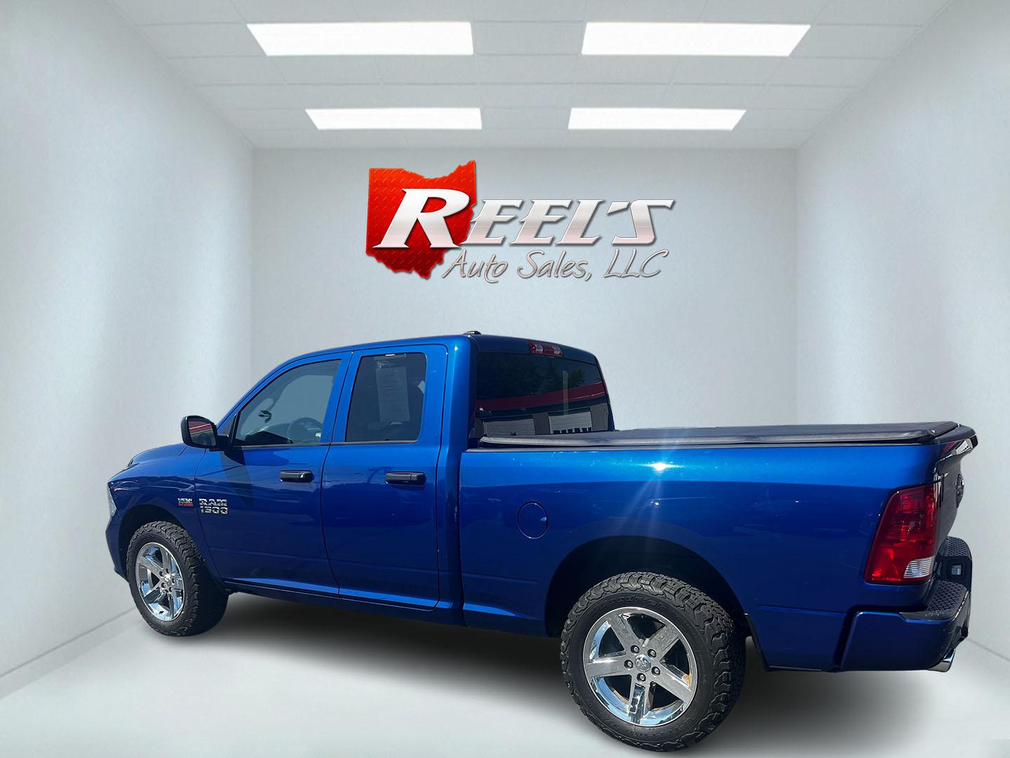 2018 Blue /Black RAM 1500 Express Quad Cab 4WD (1C6RR7FT4JS) with an 5.7L V8 OHV 16V engine, 8A transmission, located at 547 E. Main St., Orwell, OH, 44076, (440) 437-5893, 41.535435, -80.847855 - This 2018 Ram 1500 Express Quad Cab 4WD is a robust pickup truck powered by a 5.7L HEMI V8 engine, delivering 395 horsepower and paired with an 8-speed automatic transmission. This combination ensures strong performance and an 8,000-pound towing capacity, suitable for both work and recreational need - Photo#8