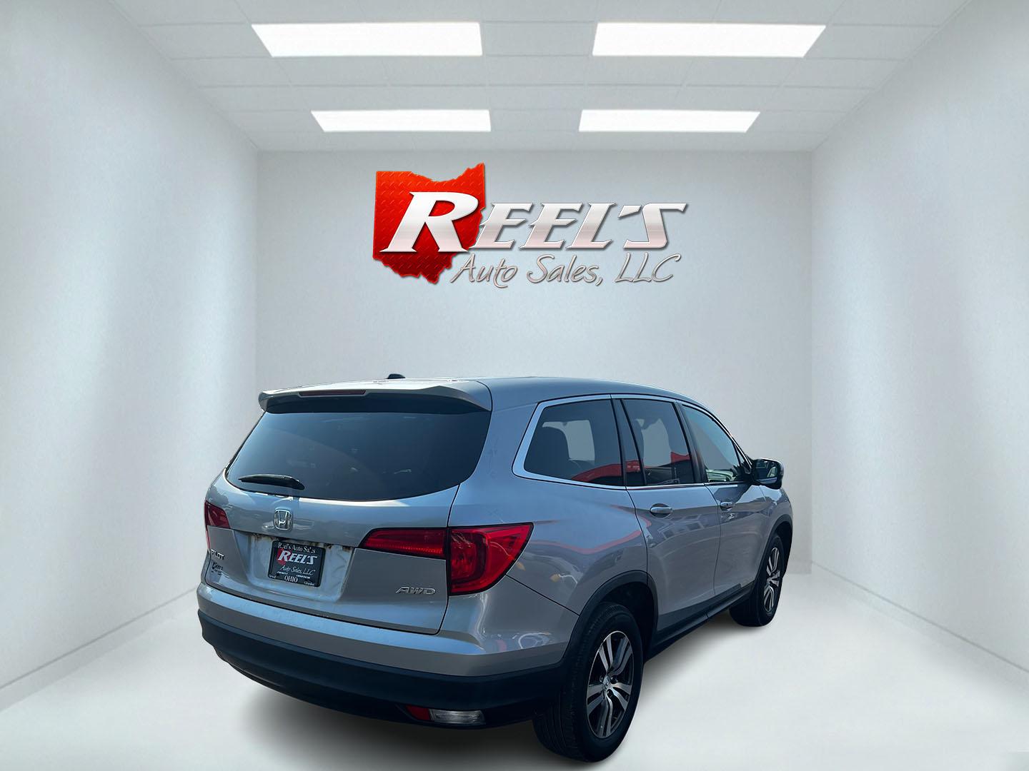 2016 Silver /Gray Honda Pilot EXL 4WD (5FNYF6H55GB) with an 3.5L V6 SOHC 24V engine, 6-Speed Automatic transmission, located at 547 E. Main St., Orwell, OH, 44076, (440) 437-5893, 41.535435, -80.847855 - This One Owner 2016 Honda Pilot EXL AWD is a well-equipped SUV designed for both comfort and versatility. It features a 3.5L EarthDreams V6 engine with a 6-speed automatic transmission, providing smooth power delivery and reliable AWD performance. The interior is luxurious with leather seating and p - Photo#5