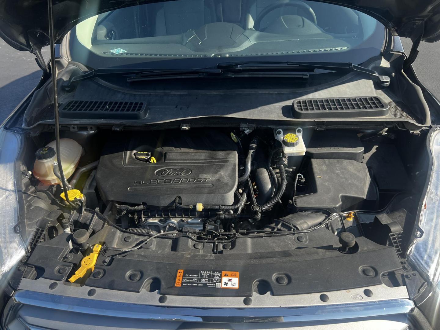 2018 Gray /Black Ford Escape SE 4WD (1FMCU9GD0JU) with an 1.5L I4 DOHC 16V TURBO engine, 6 Speed Auto transmission, located at 547 E. Main St., Orwell, OH, 44076, (440) 437-5893, 41.535435, -80.847855 - This 2018 Ford Escape SE 4WD is a compact SUV designed for efficiency and comfort, powered by a 1.5-liter turbocharged I4 EcoBoost engine, paired with a 6-speed automatic transmission, achieving an impressive 28 MPG on the highway. This Escape incorporates Auto Start Stop technology to enhance fuel - Photo#14
