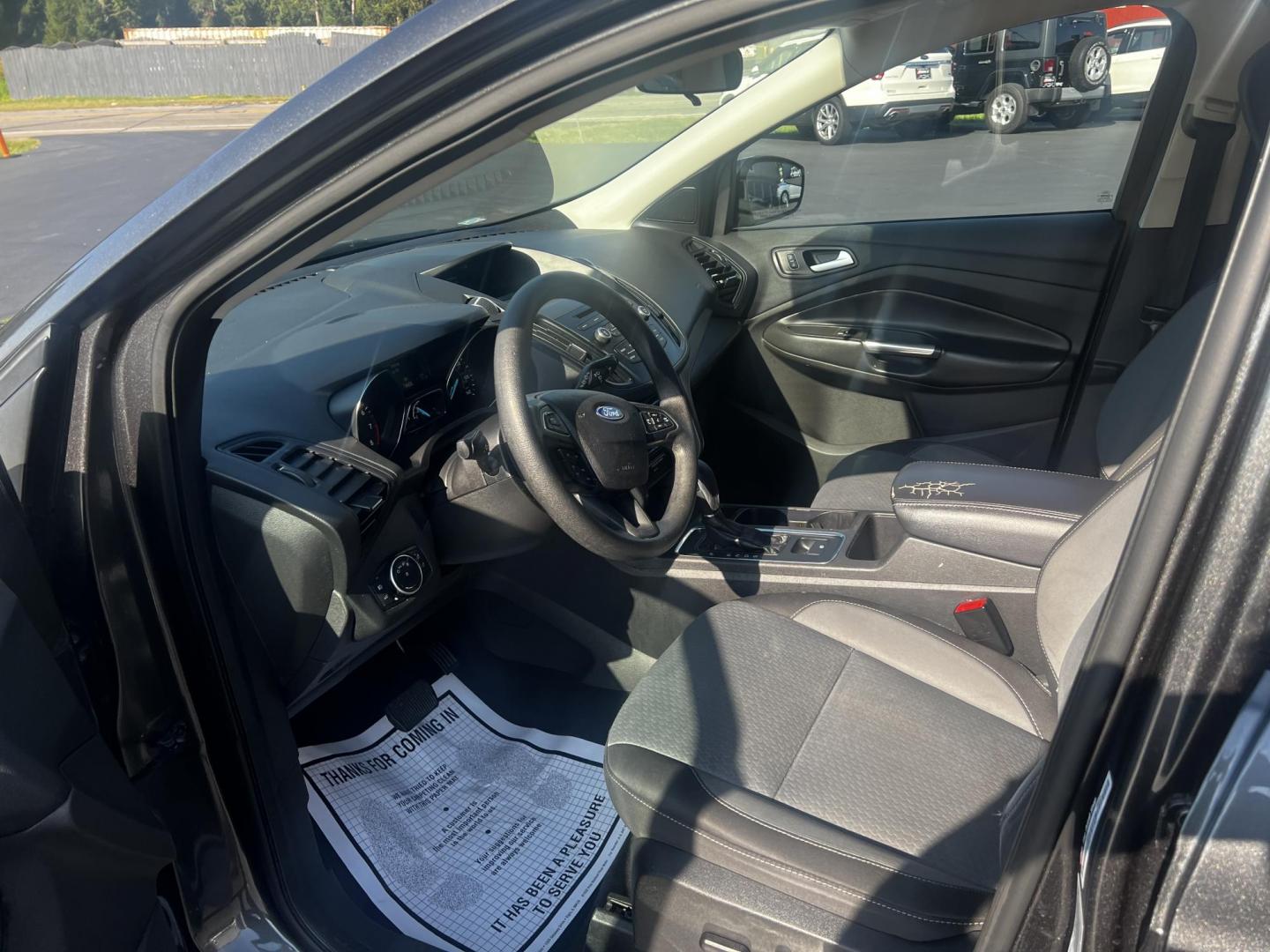 2018 Gray /Black Ford Escape SE 4WD (1FMCU9GD0JU) with an 1.5L I4 DOHC 16V TURBO engine, 6 Speed Auto transmission, located at 547 E. Main St., Orwell, OH, 44076, (440) 437-5893, 41.535435, -80.847855 - This 2018 Ford Escape SE 4WD is a compact SUV designed for efficiency and comfort, powered by a 1.5-liter turbocharged I4 EcoBoost engine, paired with a 6-speed automatic transmission, achieving an impressive 28 MPG on the highway. This Escape incorporates Auto Start Stop technology to enhance fuel - Photo#15