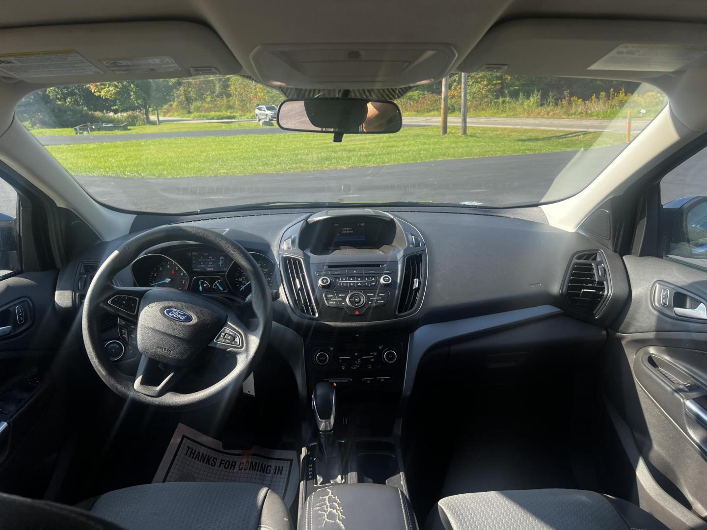 2018 Gray /Black Ford Escape SE 4WD (1FMCU9GD0JU) with an 1.5L I4 DOHC 16V TURBO engine, 6 Speed Auto transmission, located at 547 E. Main St., Orwell, OH, 44076, (440) 437-5893, 41.535435, -80.847855 - This 2018 Ford Escape SE 4WD is a compact SUV designed for efficiency and comfort, powered by a 1.5-liter turbocharged I4 EcoBoost engine, paired with a 6-speed automatic transmission, achieving an impressive 28 MPG on the highway. This Escape incorporates Auto Start Stop technology to enhance fuel - Photo#31