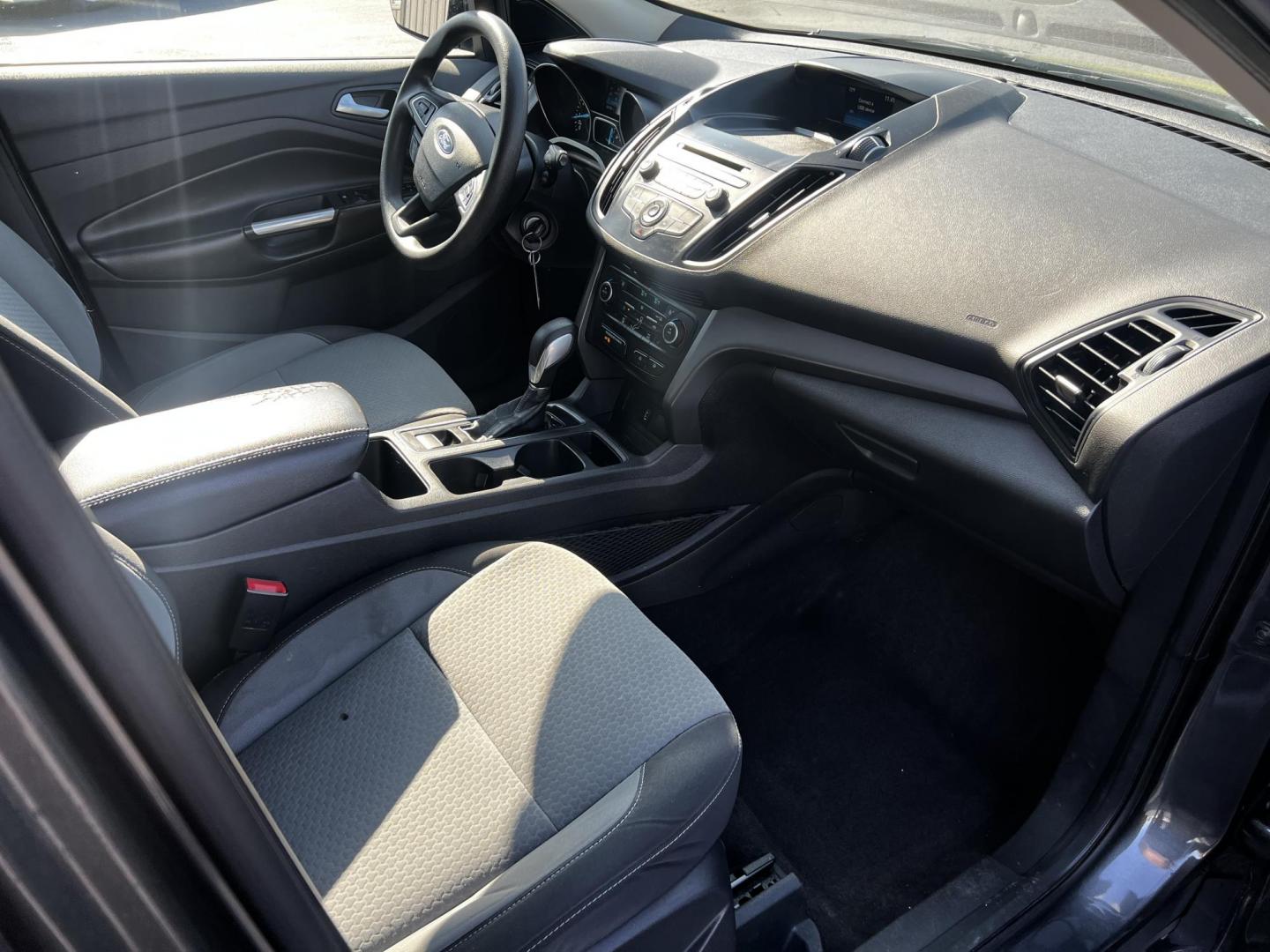 2018 Gray /Black Ford Escape SE 4WD (1FMCU9GD0JU) with an 1.5L I4 DOHC 16V TURBO engine, 6 Speed Auto transmission, located at 547 E. Main St., Orwell, OH, 44076, (440) 437-5893, 41.535435, -80.847855 - This 2018 Ford Escape SE 4WD is a compact SUV designed for efficiency and comfort, powered by a 1.5-liter turbocharged I4 EcoBoost engine, paired with a 6-speed automatic transmission, achieving an impressive 28 MPG on the highway. This Escape incorporates Auto Start Stop technology to enhance fuel - Photo#36