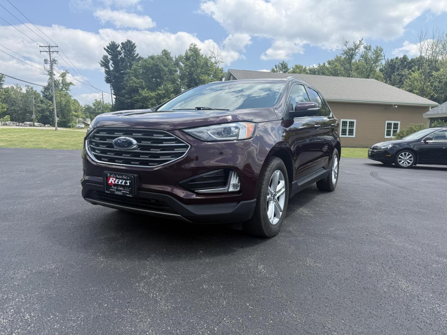 2019 Burgundy /Black Ford Edge SEL AWD (2FMPK4J96KB) with an 2.0L I4 DOHC 16V Turbo engine, 8-Speed Automatic transmission, located at 11115 Chardon Rd. , Chardon, OH, 44024, (440) 214-9705, 41.580246, -81.241943 - FRESH TRADE ALET ----- 2019 Ford Edge SEL AWD is a sophisticated midsize SUV combining performance, technology, and comfort. It features a 2.0-liter turbocharged I4 EcoBoost engine with a 8-speed automatic transmission, providing a balanced driving experience with efficiency and power. The interior - Photo#0