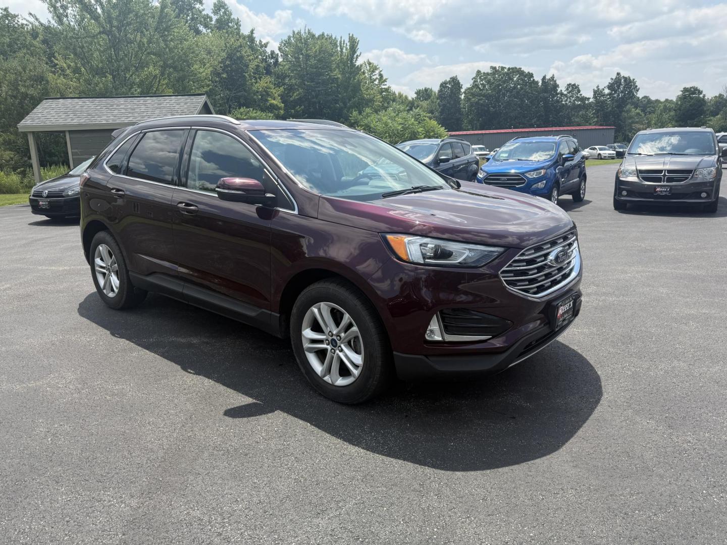2019 Burgundy /Black Ford Edge SEL AWD (2FMPK4J96KB) with an 2.0L I4 DOHC 16V Turbo engine, 8-Speed Automatic transmission, located at 11115 Chardon Rd. , Chardon, OH, 44024, (440) 214-9705, 41.580246, -81.241943 - FRESH TRADE ALET ----- 2019 Ford Edge SEL AWD is a sophisticated midsize SUV combining performance, technology, and comfort. It features a 2.0-liter turbocharged I4 EcoBoost engine with a 8-speed automatic transmission, providing a balanced driving experience with efficiency and power. The interior - Photo#2
