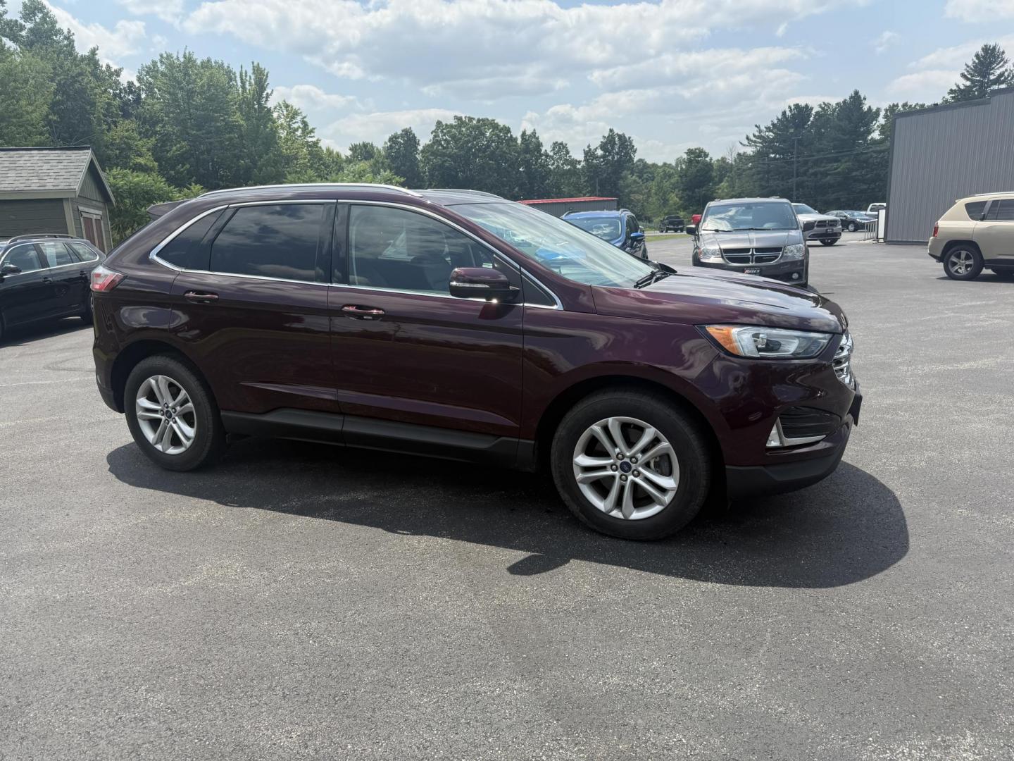 2019 Burgundy /Black Ford Edge SEL AWD (2FMPK4J96KB) with an 2.0L I4 DOHC 16V Turbo engine, 8-Speed Automatic transmission, located at 11115 Chardon Rd. , Chardon, OH, 44024, (440) 214-9705, 41.580246, -81.241943 - FRESH TRADE ALET ----- 2019 Ford Edge SEL AWD is a sophisticated midsize SUV combining performance, technology, and comfort. It features a 2.0-liter turbocharged I4 EcoBoost engine with a 8-speed automatic transmission, providing a balanced driving experience with efficiency and power. The interior - Photo#3