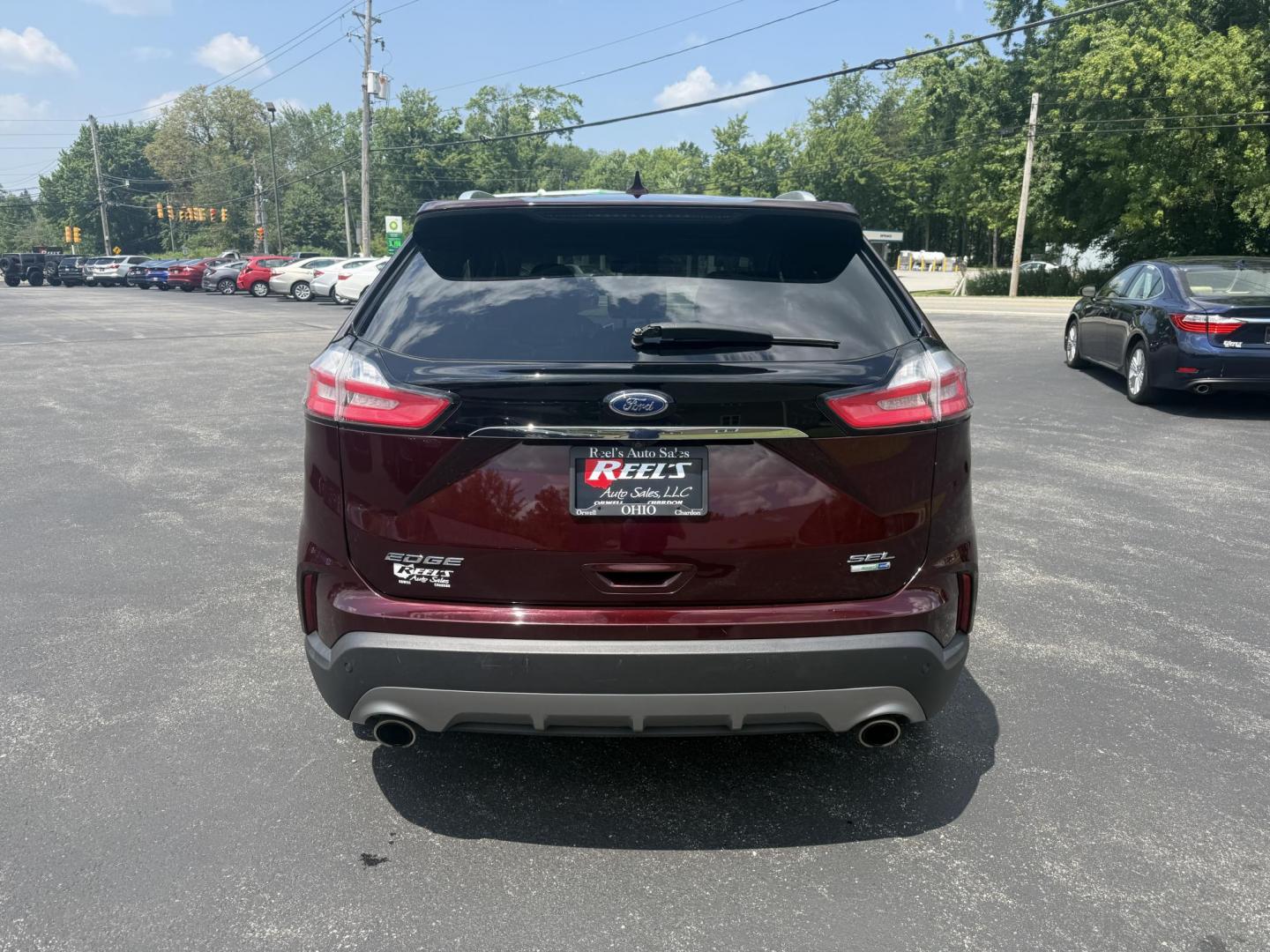 2019 Burgundy /Black Ford Edge SEL AWD (2FMPK4J96KB) with an 2.0L I4 DOHC 16V Turbo engine, 8-Speed Automatic transmission, located at 11115 Chardon Rd. , Chardon, OH, 44024, (440) 214-9705, 41.580246, -81.241943 - FRESH TRADE ALET ----- 2019 Ford Edge SEL AWD is a sophisticated midsize SUV combining performance, technology, and comfort. It features a 2.0-liter turbocharged I4 EcoBoost engine with a 8-speed automatic transmission, providing a balanced driving experience with efficiency and power. The interior - Photo#8