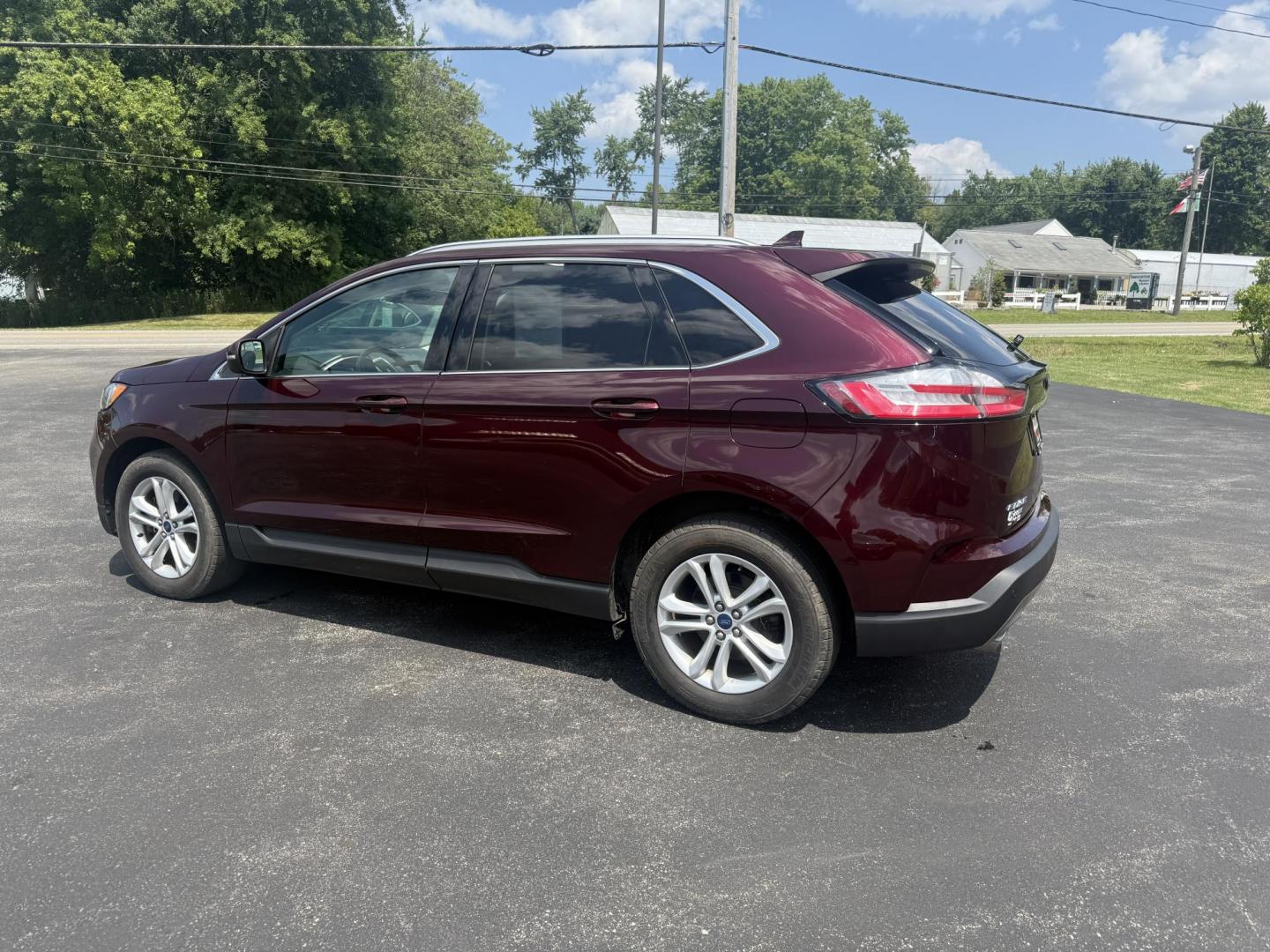 2019 Burgundy /Black Ford Edge SEL AWD (2FMPK4J96KB) with an 2.0L I4 DOHC 16V Turbo engine, 8-Speed Automatic transmission, located at 11115 Chardon Rd. , Chardon, OH, 44024, (440) 214-9705, 41.580246, -81.241943 - FRESH TRADE ALET ----- 2019 Ford Edge SEL AWD is a sophisticated midsize SUV combining performance, technology, and comfort. It features a 2.0-liter turbocharged I4 EcoBoost engine with a 8-speed automatic transmission, providing a balanced driving experience with efficiency and power. The interior - Photo#10