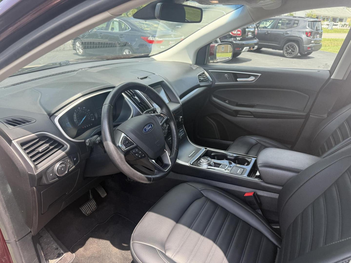 2019 Burgundy /Black Ford Edge SEL AWD (2FMPK4J96KB) with an 2.0L I4 DOHC 16V Turbo engine, 8-Speed Automatic transmission, located at 11115 Chardon Rd. , Chardon, OH, 44024, (440) 214-9705, 41.580246, -81.241943 - FRESH TRADE ALET ----- 2019 Ford Edge SEL AWD is a sophisticated midsize SUV combining performance, technology, and comfort. It features a 2.0-liter turbocharged I4 EcoBoost engine with a 8-speed automatic transmission, providing a balanced driving experience with efficiency and power. The interior - Photo#15