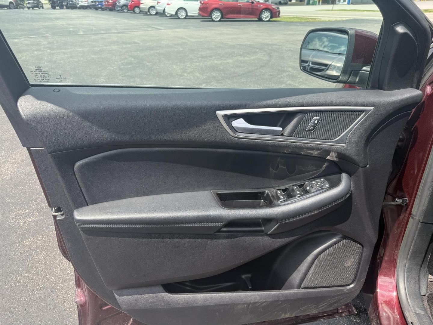 2019 Burgundy /Black Ford Edge SEL AWD (2FMPK4J96KB) with an 2.0L I4 DOHC 16V Turbo engine, 8-Speed Automatic transmission, located at 11115 Chardon Rd. , Chardon, OH, 44024, (440) 214-9705, 41.580246, -81.241943 - FRESH TRADE ALET ----- 2019 Ford Edge SEL AWD is a sophisticated midsize SUV combining performance, technology, and comfort. It features a 2.0-liter turbocharged I4 EcoBoost engine with a 8-speed automatic transmission, providing a balanced driving experience with efficiency and power. The interior - Photo#16