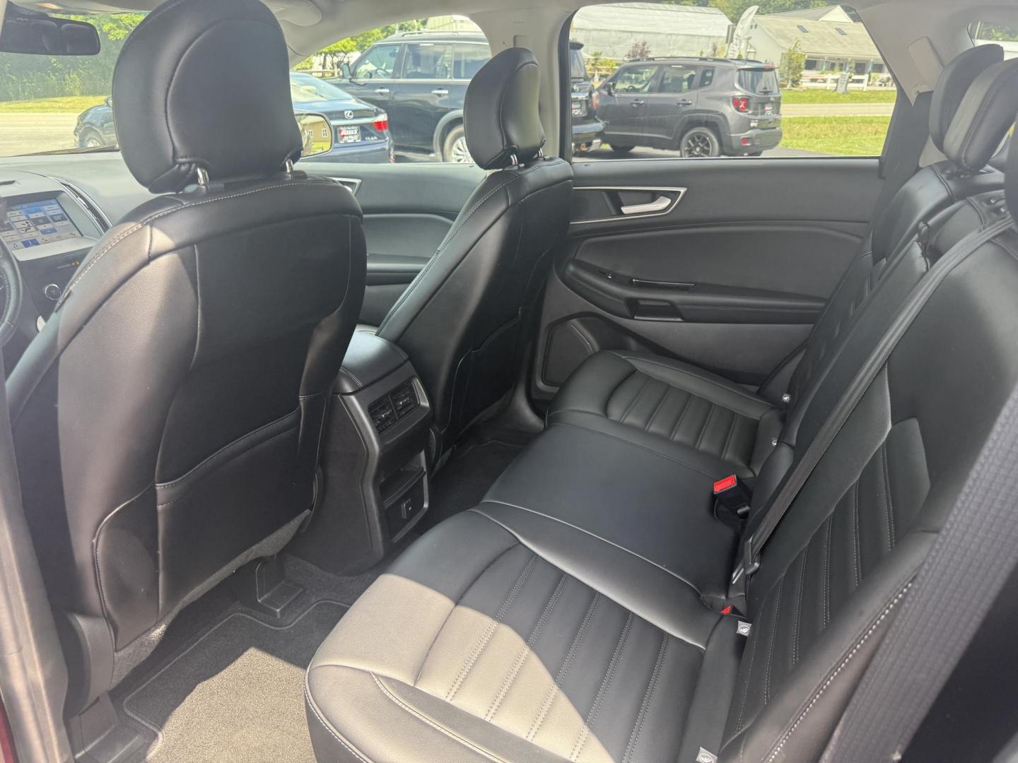 2019 Burgundy /Black Ford Edge SEL AWD (2FMPK4J96KB) with an 2.0L I4 DOHC 16V Turbo engine, 8-Speed Automatic transmission, located at 11115 Chardon Rd. , Chardon, OH, 44024, (440) 214-9705, 41.580246, -81.241943 - FRESH TRADE ALET ----- 2019 Ford Edge SEL AWD is a sophisticated midsize SUV combining performance, technology, and comfort. It features a 2.0-liter turbocharged I4 EcoBoost engine with a 8-speed automatic transmission, providing a balanced driving experience with efficiency and power. The interior - Photo#33