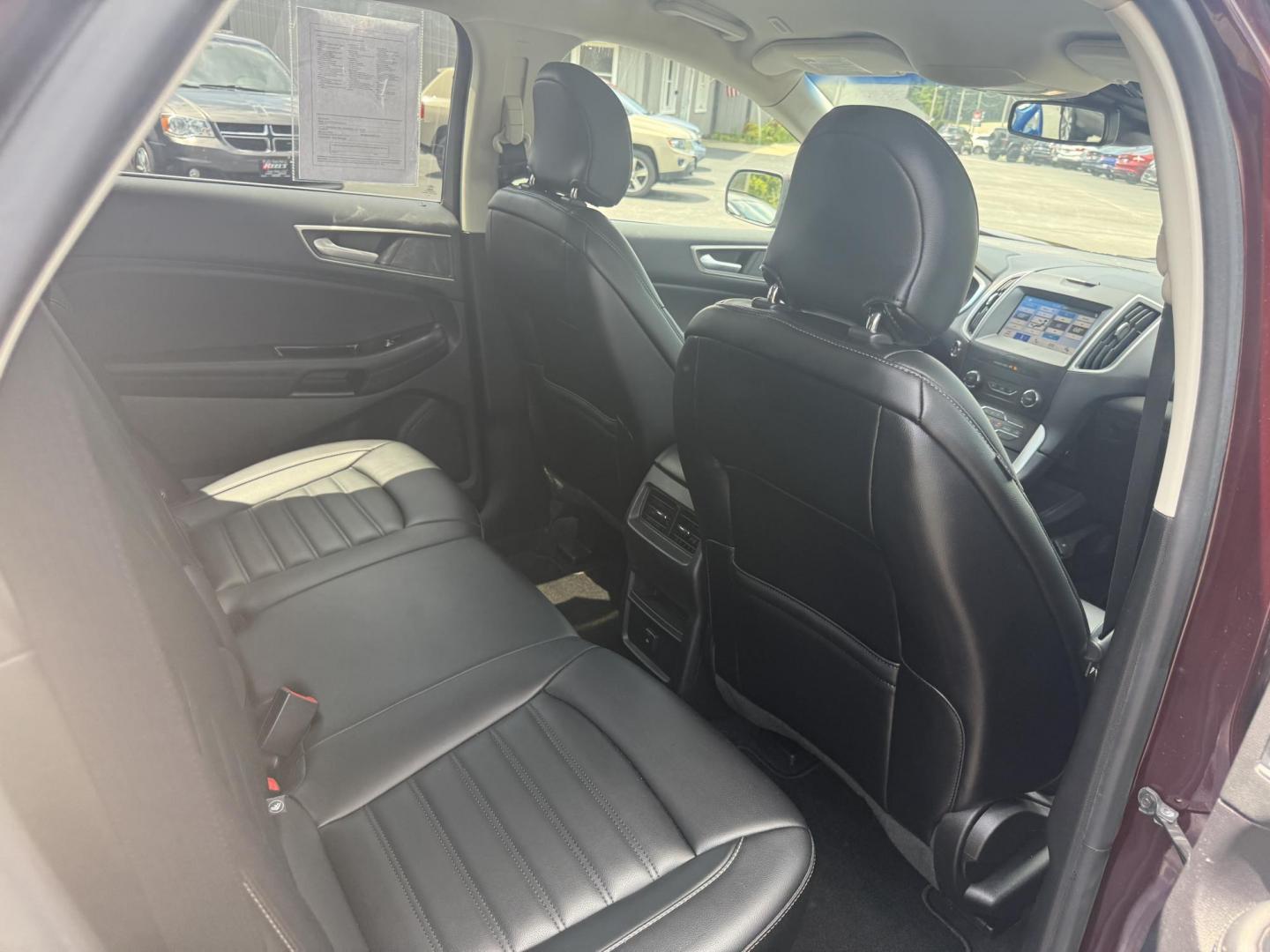 2019 Burgundy /Black Ford Edge SEL AWD (2FMPK4J96KB) with an 2.0L I4 DOHC 16V Turbo engine, 8-Speed Automatic transmission, located at 11115 Chardon Rd. , Chardon, OH, 44024, (440) 214-9705, 41.580246, -81.241943 - FRESH TRADE ALET ----- 2019 Ford Edge SEL AWD is a sophisticated midsize SUV combining performance, technology, and comfort. It features a 2.0-liter turbocharged I4 EcoBoost engine with a 8-speed automatic transmission, providing a balanced driving experience with efficiency and power. The interior - Photo#40