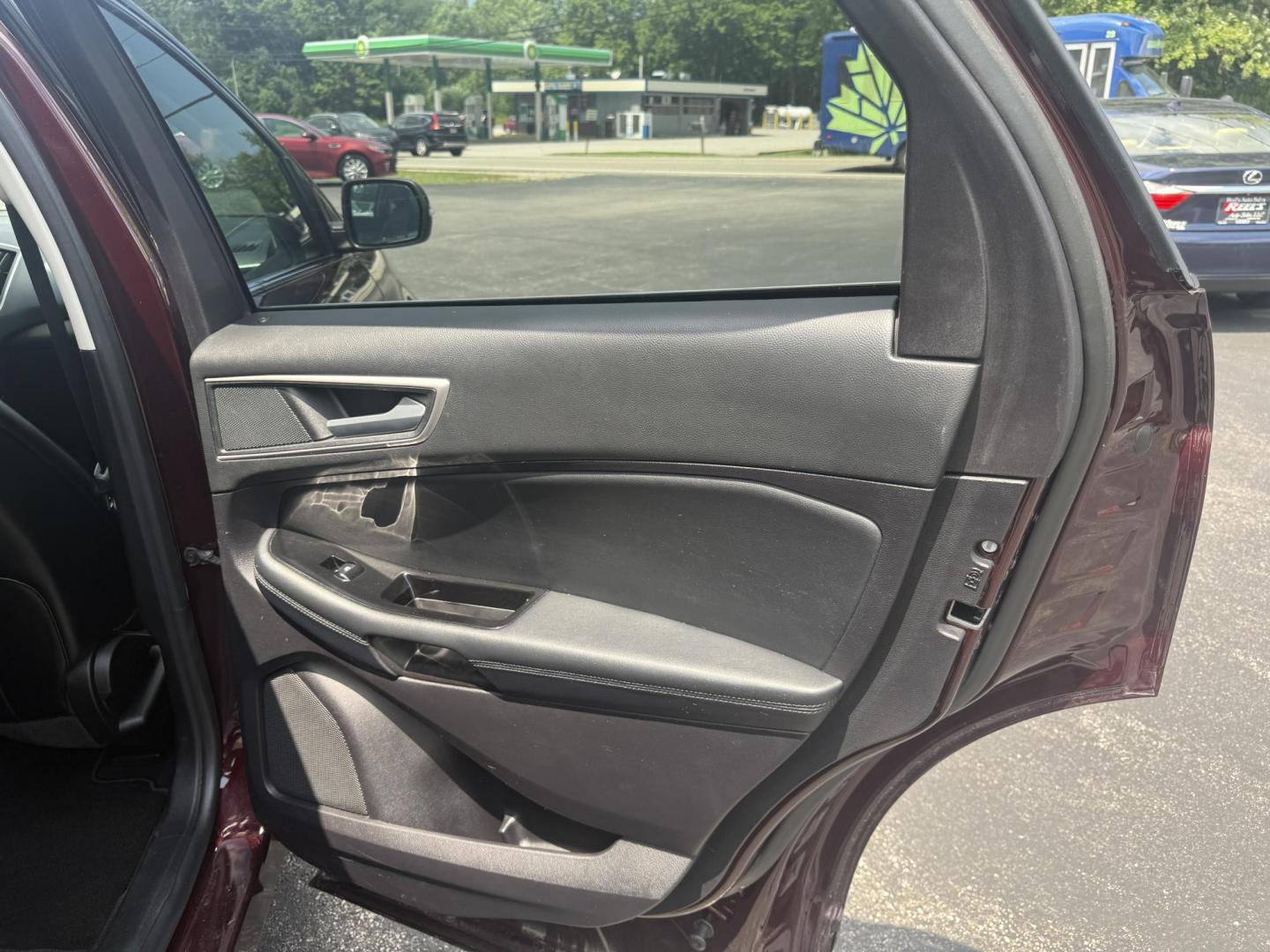 2019 Burgundy /Black Ford Edge SEL AWD (2FMPK4J96KB) with an 2.0L I4 DOHC 16V Turbo engine, 8-Speed Automatic transmission, located at 11115 Chardon Rd. , Chardon, OH, 44024, (440) 214-9705, 41.580246, -81.241943 - FRESH TRADE ALET ----- 2019 Ford Edge SEL AWD is a sophisticated midsize SUV combining performance, technology, and comfort. It features a 2.0-liter turbocharged I4 EcoBoost engine with a 8-speed automatic transmission, providing a balanced driving experience with efficiency and power. The interior - Photo#41