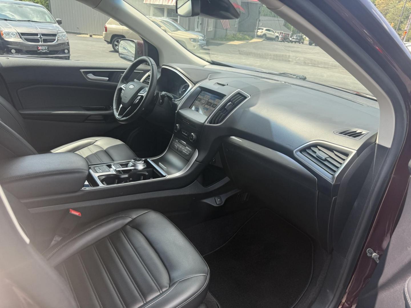 2019 Burgundy /Black Ford Edge SEL AWD (2FMPK4J96KB) with an 2.0L I4 DOHC 16V Turbo engine, 8-Speed Automatic transmission, located at 11115 Chardon Rd. , Chardon, OH, 44024, (440) 214-9705, 41.580246, -81.241943 - FRESH TRADE ALET ----- 2019 Ford Edge SEL AWD is a sophisticated midsize SUV combining performance, technology, and comfort. It features a 2.0-liter turbocharged I4 EcoBoost engine with a 8-speed automatic transmission, providing a balanced driving experience with efficiency and power. The interior - Photo#42