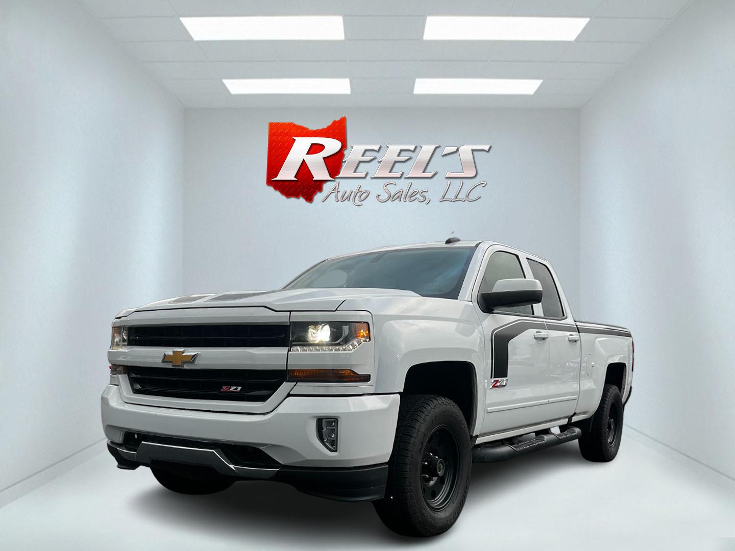 2016 White /Black Chevrolet Silverado 1500 LT Z71 Double Cab 4WD (1GCVKRECXGZ) with an 5.3L V8 OHV 16V engine, 6 Speed Auto transmission, located at 11115 Chardon Rd. , Chardon, OH, 44024, (440) 214-9705, 41.580246, -81.241943 - This 2016 Chevrolet Silverado LT Z71 Double Cab 4WD is a robust and versatile pickup truck, powered by a 5.3-liter Vortec V8 engine paired with a 6-speed automatic transmission, providing reliable performance and a towing capacity of 9,200 pounds. This model is well-equipped with modern amenities su - Photo#0