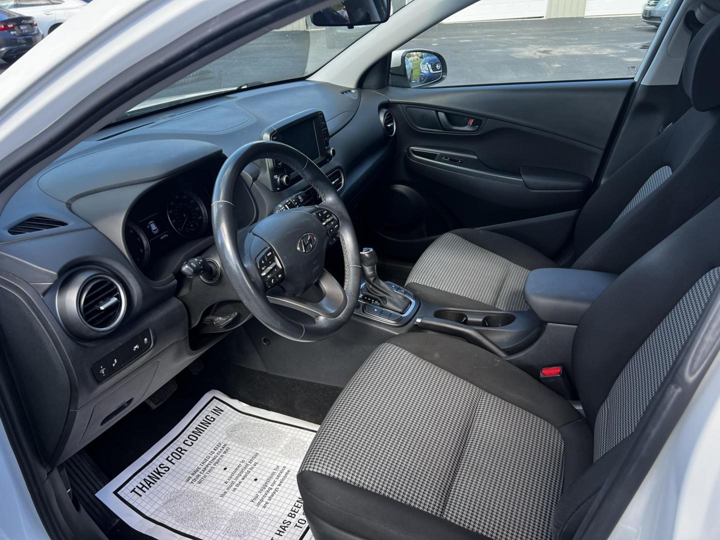2019 White /Black Hyundai Kona SEL AWD (KM8K2CAA7KU) with an 2.0L I4 DOHC 16V engine, 6 Speed Automatic transmission, located at 547 E. Main St., Orwell, OH, 44076, (440) 437-5893, 41.535435, -80.847855 - This One Owner 2019 Hyundai Kona SEL AWD is a compact SUV that combines efficiency, safety, and technology features. Powered by a 2.0-liter I4 Atkinson engine coupled with a 6-speed automatic transmission, it delivers a commendable fuel efficiency of approximately 30 MPG on the highway. It is equipp - Photo#4