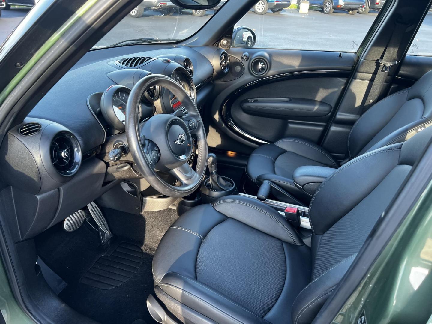 2016 Green /Black Mini Countryman S ALL4 (WMWZC5C5XGW) with an 1.6L I4 DOHC 16V TURBO engine, 8-Speed Automatic transmission, located at 11115 Chardon Rd. , Chardon, OH, 44024, (440) 214-9705, 41.580246, -81.241943 - This One Owner 2016 Mini Cooper S Countryman All4 is a compact SUV offering a blend of performance and premium features. It features a 1.6-liter turbocharged inline-4 engine producing 181 horsepower, paired with an 8-speed automatic transmission. Notable for its sporty drive, it can accelerate from - Photo#16