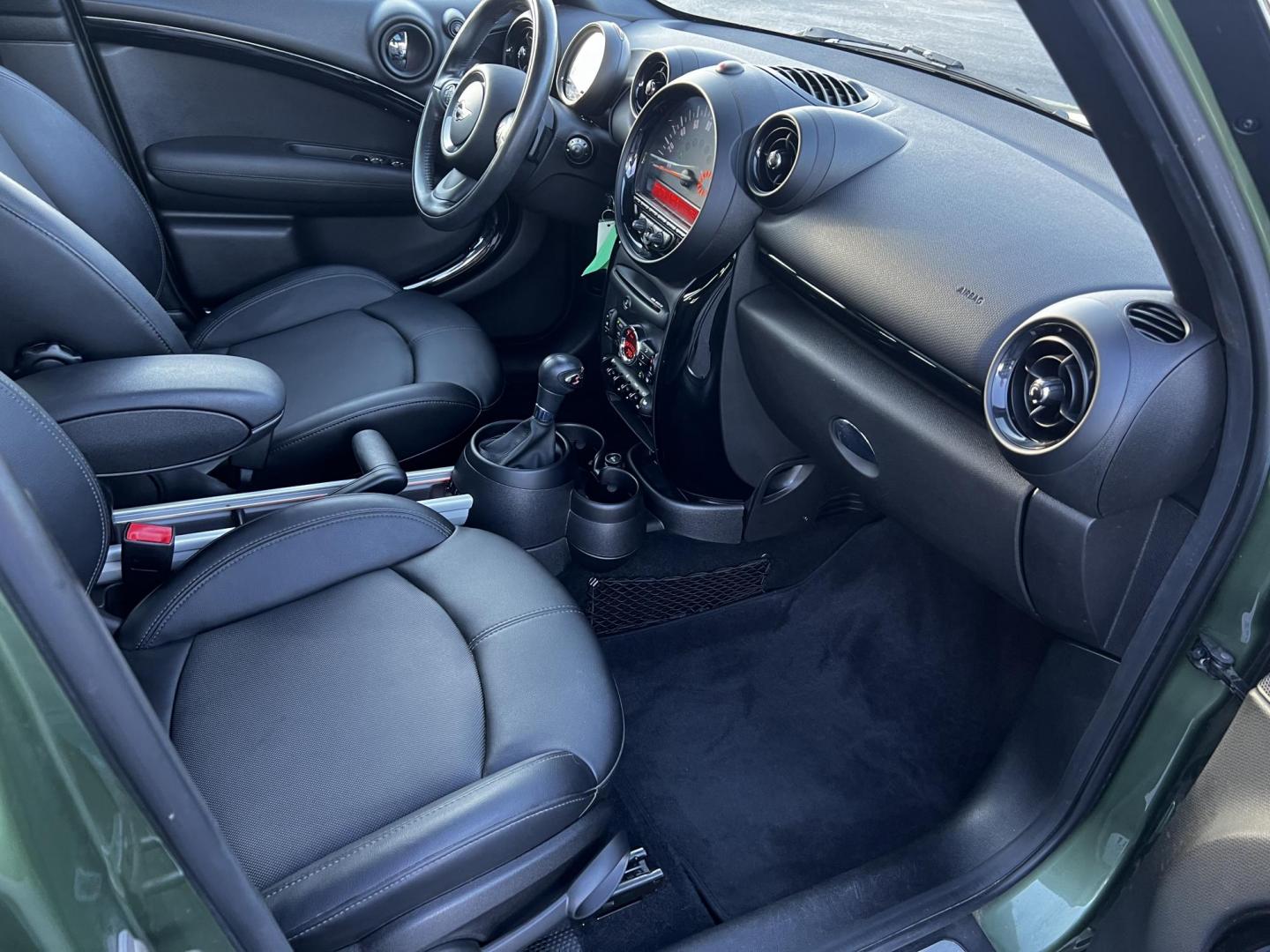 2016 Green /Black Mini Countryman S ALL4 (WMWZC5C5XGW) with an 1.6L I4 DOHC 16V TURBO engine, 8-Speed Automatic transmission, located at 11115 Chardon Rd. , Chardon, OH, 44024, (440) 214-9705, 41.580246, -81.241943 - This One Owner 2016 Mini Cooper S Countryman All4 is a compact SUV offering a blend of performance and premium features. It features a 1.6-liter turbocharged inline-4 engine producing 181 horsepower, paired with an 8-speed automatic transmission. Notable for its sporty drive, it can accelerate from - Photo#35