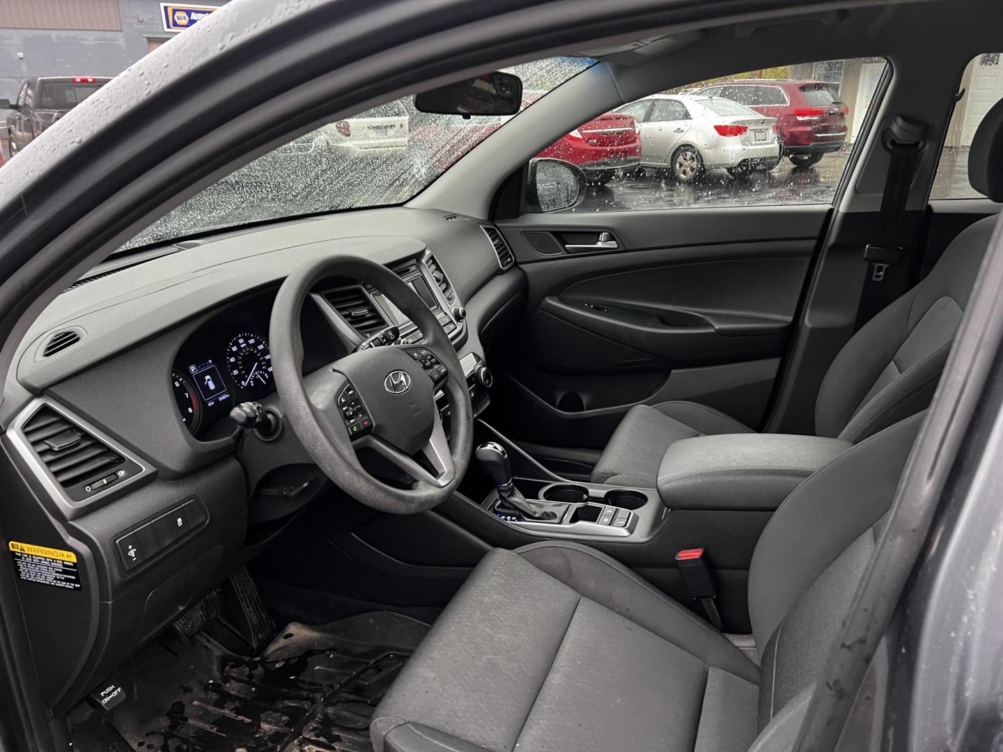 2017 Gray /Black Hyundai Tucson SE w/Popular Package AWD (KM8J3CA43HU) with an 2.0L I4 DOHC 16V engine, 6 Speed Auto transmission, located at 11115 Chardon Rd. , Chardon, OH, 44024, (440) 214-9705, 41.580246, -81.241943 - This 2017 Hyundai Tucson SE AWD is a well-rounded compact SUV that offers a balance of efficiency, technology, and functionality. Powered by a 2.0 I4 GDI engine and equipped with a 6-speed automatic transmission, it provides a commendable fuel efficiency of 26 MPG on the highway. This vehicle includ - Photo#3