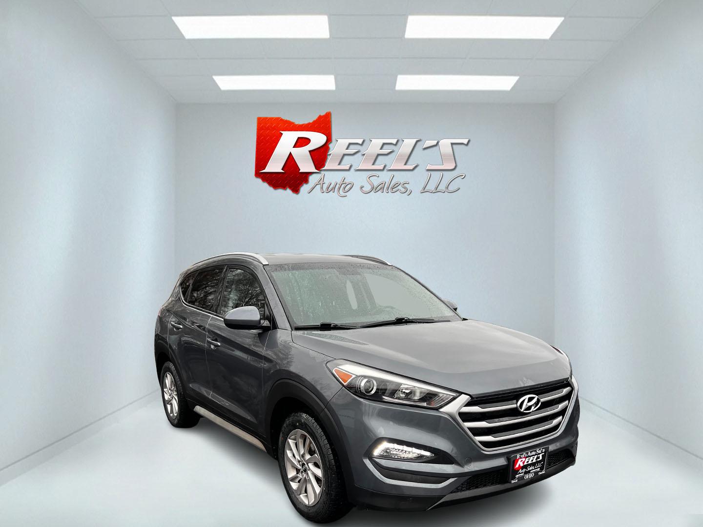 2017 Gray /Black Hyundai Tucson SE w/Popular Package AWD (KM8J3CA43HU) with an 2.0L I4 DOHC 16V engine, 6 Speed Auto transmission, located at 11115 Chardon Rd. , Chardon, OH, 44024, (440) 214-9705, 41.580246, -81.241943 - This 2017 Hyundai Tucson SE AWD is a well-rounded compact SUV that offers a balance of efficiency, technology, and functionality. Powered by a 2.0 I4 GDI engine and equipped with a 6-speed automatic transmission, it provides a commendable fuel efficiency of 26 MPG on the highway. This vehicle includ - Photo#2