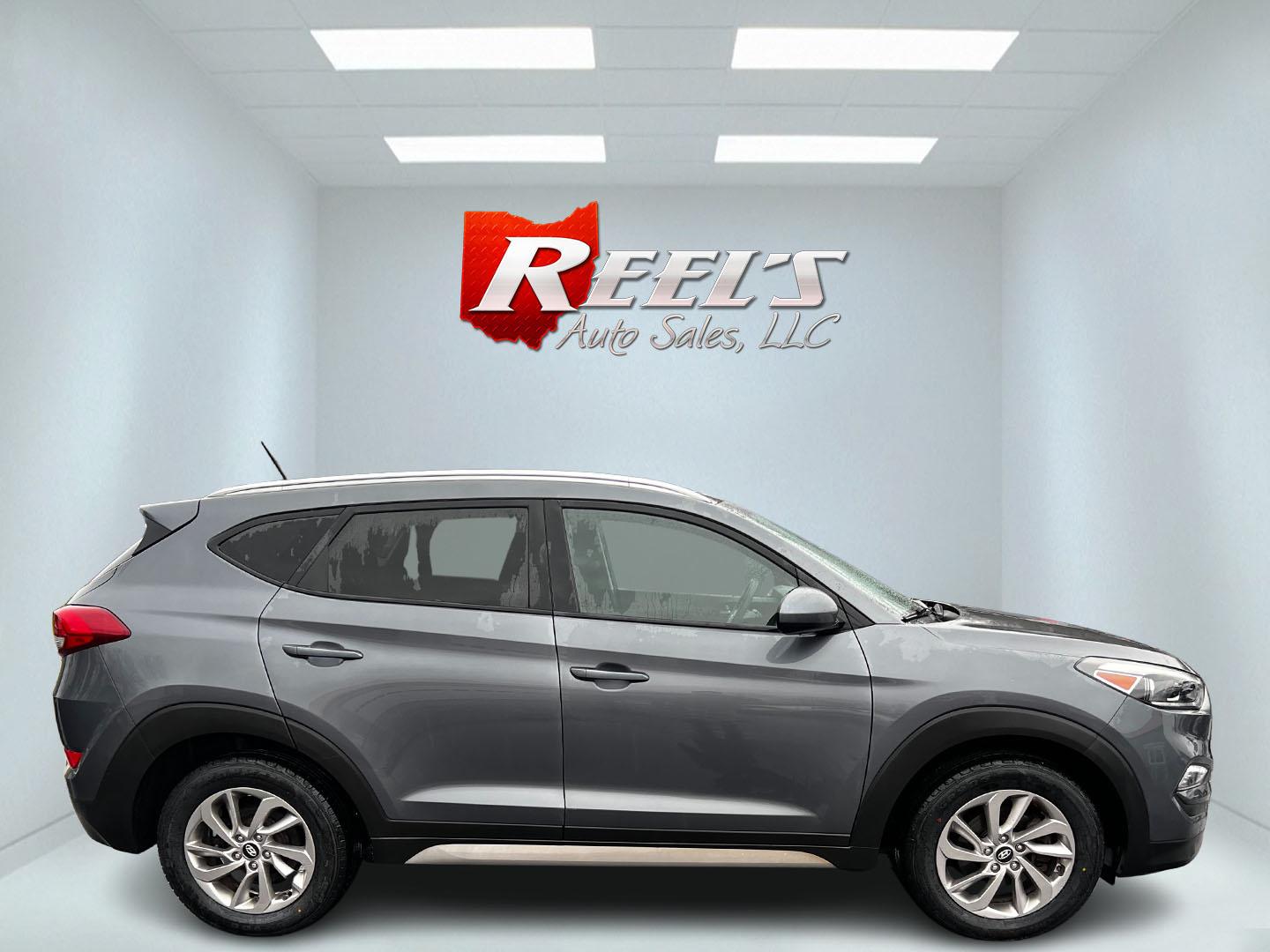 2017 Gray /Black Hyundai Tucson SE w/Popular Package AWD (KM8J3CA43HU) with an 2.0L I4 DOHC 16V engine, 6 Speed Auto transmission, located at 11115 Chardon Rd. , Chardon, OH, 44024, (440) 214-9705, 41.580246, -81.241943 - This 2017 Hyundai Tucson SE AWD is a well-rounded compact SUV that offers a balance of efficiency, technology, and functionality. Powered by a 2.0 I4 GDI engine and equipped with a 6-speed automatic transmission, it provides a commendable fuel efficiency of 26 MPG on the highway. This vehicle includ - Photo#14
